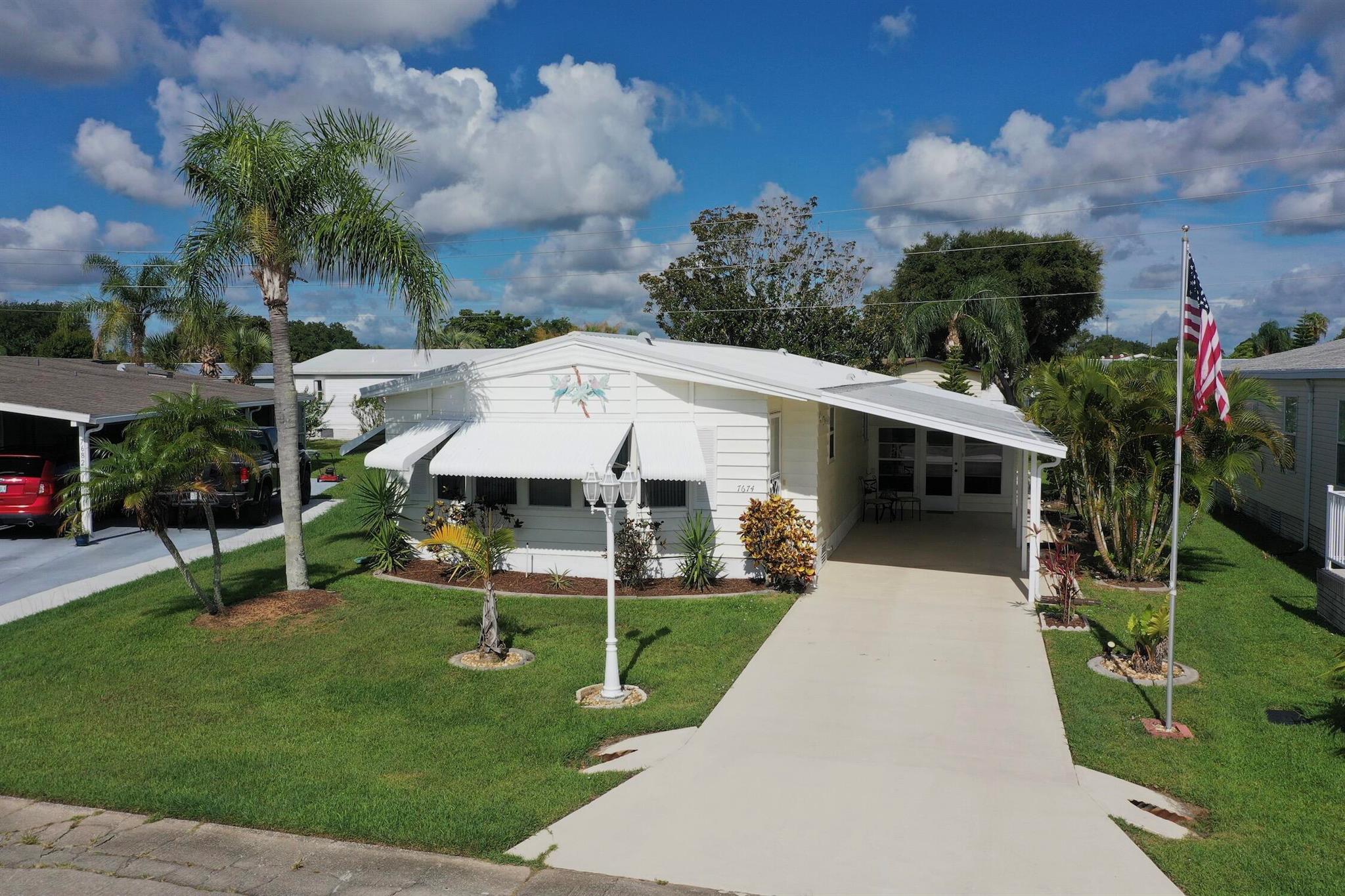 Roomy interior boasts of Florida room in front with full walk a bay window. Archways lead to living room on one side and dining with built in hutch on the other. Chefs kitchen has an abundance of counterspace and cabinetry storage. Interior bonus room has built in desk and W/D. Gather with friends on the glass enclosed porch that offers a northeast breeze. Unpack and relax, comes fully furnished.