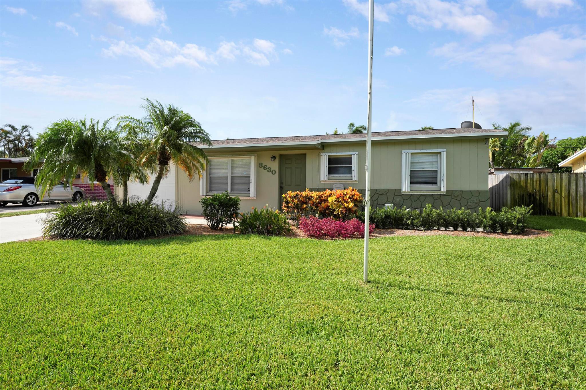 Welcome home to 3630 Island Road in the heart of Palm Beach Gardens. This 3-bedroom, 1-bath pool home, nestled in Cabana Colony, is ready for your personal touch and has so much potential. It features a brand new roof (2024), full hurricane protection, updated electrical panel, newer AC/duct work (2021), and a gorgeous pool in a fully fenced-in yard. This home features an open floor plan, large pantry and indoor laundry. Ideally located close to the Palm Beach Gardens mall, Downtown at the Gardens, and minutes from the beach, this home is situated in a non-HOA community with a community park. Bring your boat and RV. Perfect for a first-time homebuyer or investor.