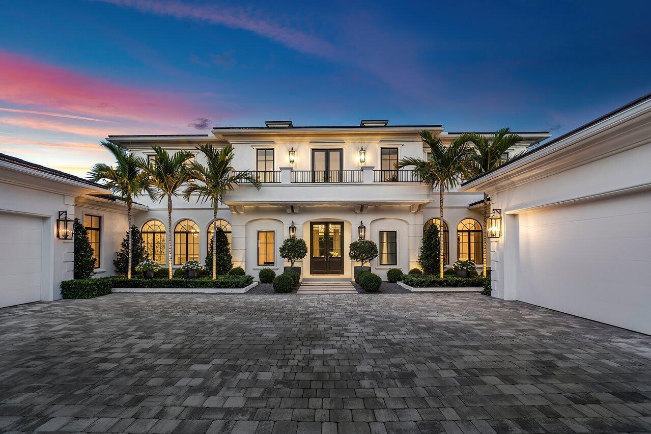 Welcome to this luxurious residence located in North Palm Beach's most prestigious community, Seminole Landing. Constructed in 2020, this stunning property spans over 12,000 square feet of meticulously designed indoor and outdoor living space, offering the perfect blend of elegance and modern convenience.As you step inside, you'll be captivated by the grandeur of the open concept living areas, flooded withnatural light and adorned with the finest finishes. Venetian plaster walls throughout the main spacesdelicately reflect the light and exude elegance and craftsmanship. Wood flooring warms up the space andprovides a visual flow between the​​‌​​​​‌​​‌‌​‌‌‌​​‌‌​‌‌‌​​‌‌​‌‌‌ rooms. The foyer, with its stunning custom starburst chandelier,
immediately opens to the living room via a large feature opening in which the jamb is clad in one-of-a-kind, reflective polished stainless metal. The living room offers classic details such as coffered ceilings, a white marble display fireplace, and floor to ceiling windows flanked with Great Plain sheer drapes, that allow for an extended view of the infinity pool and garden beyond.

Just off the living room, at the heart of this magnificent home, lies the state-of-the-art chef's kitchen, a culinary masterpiece that will inspire your inner gourmet. The kitchen is equipped with top-of-the-line appliances, including a Wolf professional-grade range, a built-in Sub-Zero refrigerator, and dual dishwashers. The expansive island, crafted from exquisite nile white quartzite in a leathered finish features a custom-designed wrap-around cantilever wood counter, which provides both ample space for meal preparation and casual dining. The custom cabinetry offers abundant storage as well as a display area with a tall, metal and glass storage cabinet flanking the range. A walk-in pantry completes this dream kitchen, making it as functional as it is beautiful. The kitchen opens to a comfortable family room, with contemporary custom built-in housing an entertainment center and providing both display and closed storage.

A formal dining room sits at the front of the house, elegantly framed by 3 large arched windows and 3 arched openings to the hallway and defined by a herringbone-patterned wood floor. A silver leaf inset ceiling and Venetian plaster walls beautifully reflect the light of this open and inviting room.

The downstairs guest suite, just off the main spaces, offers the perfect balance of proximity and privacy for visiting guests. Off white Scalamandre grasscloth wallpaper quietly textures the walls and cushions the acoustics of the room. The large en suite bathroom provides every comfort with its statement Nero Marquina marble slab shower walls and stone-clad sink vanity paired with classic white Dolomite herringbone floors. Modern Kohler brass plumbing fixtures, and a large freestanding MTI soaking tub complete this Parisian-inspired luxury bathroom.

The family room opens up to the home's entertainment areas. A game/club room includes a bar area with a Panda marble waterfall countertop and open shelving for displaying bottles and glasses. This large space allows plenty of room for gathering friends around a pool or ping pong table and opens out to the covered loggia and summer kitchen, perfect for indoor/outdoor entertaining. An adjoining powder room features textured black granite slab wainscotting on lower walls and Elitis wallpaper above. The theater room sits just off the club room. With its black fabric-covered walls, Elitis black shimmer drape, motorized, Romo Black velvet recliners, and large velvet daybeds, it is a dark and cozy haven for gathering friends and family for a movie.

As we move upstairs, a large loft offers additional space for relaxation or work. The custom built-in has 2 workstations conveniently outfitted with cord and plug access but beautifully finished with Venetian plaster, birds eye maple wood countertops, and Innovations textured wallpaper.

The primary suite, located on the upper level, is a haven of tranquility. The bedroom features a stunning bookmatched, Macabus Fantasy marble slab wall with a linear ethanol fireplace and a private balcony with breathtaking views. His bathroom has been newly renovated with Arabascato marble slab shower walls, stone vanity cladding with integrated stone sink, and matte plaster walls and cabinetry. Her bathroom is a feminine palette of Karib White marble, Waterworks plumbing fixtures, separate sink and makeup vanities, and a large freestanding tub. Expansive His and Her walk-in closets and a morning bar complete the custom amenities of this spacious primary suite.

From the luxurious living spaces to the high-end amenities, this residence offers a lifestyle of unparalleled comfort and style. The home includes a versatile recreational room for sports and family fun, an immersive theater room for private screenings, and an exercise room with state-of-the-art equipment and stunning views. The chic club room, perfect for social gatherings, seamlessly leads to the outdoor family loggia, where you can relax and entertain in style.

The outdoor oasis is truly remarkable, featuring an oversized infinity pool with an overhanging water feature, a luxurious spa, and a beautifully landscaped yard with lush grass. 
Enjoy a putting green, a summer kitchen for alfresco dining with Black Dragon marble-clad walls, and private basketball and pickleball courts. A beautifully appointed cabana bath with Elitis wallpaper seamlessly connects the indoor and outdoor areas for relaxation and enjoyment. This home effortlessly combines luxury and functionality, providing an exceptional lifestyle in one of the most sought-after locations.

Additional features of this magnificent estate include a four-car garage, downstairs and upstairs full laundry rooms, a hallway mudroom bench with hidden cabinet storage, all impact glass windows, a convenient elevator that provides seamless access to all floors and a quiet cul-de-sac location over an acre of land, offering privacy and tranquility. The home is equipped with a complete Lutron lighting system and a Crestron system, allowing for effortless control of lighting, climate, security, and entertainment through an intelligent platform.

The lush landscaping and mature oak, banyan trees, and tropical vegetation throughout the Seminole Landing community create a serene and picturesque environment. This prestigious gated community, nestled within the legendary Seminole Golf Club, offers full-time security, exclusive ocean access, and tennis courts. With only 65 single-family homes, Seminole Landing provides the beauty of prime oceanfront living with the tranquility and privacy you desire.

This exquisite residence presents a rare opportunity to own a piece of paradise in one of North Palm Beach's most coveted communities. Perfectly situated, this home is mere moments away 
from exclusive shopping destinations at The Gardens Mall, waterfront culinary experiences, renowned golf courses, and an array of entertainment options. Conveniently positioned near premier neighboring areas, travel connections are effortlessly accessible, ensuring seamless access to luxury amenities and cultural delights.