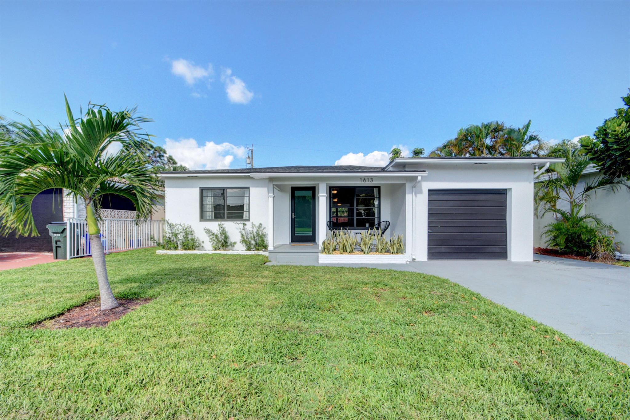 Welcome to your dream home in the heart of Lake Worth Beach! This charming 2 BR/2 bath was recently remodeled in 2022. Enjoy peace of mind with a new roof, impact windows, and tankless hot water heater, all installed in 2022, and stay cool with the new air conditioner added in 2023. Outdoor living is a delight with a large open patio, ideal for entertaining or relaxing under the Florida sun. The expansive fenced yard provides ample space and is ready for you to add a pool, creating your own private oasis. This home perfectly blends modern updates with comfortable living, making it a must-see in Lake Worth Beach.