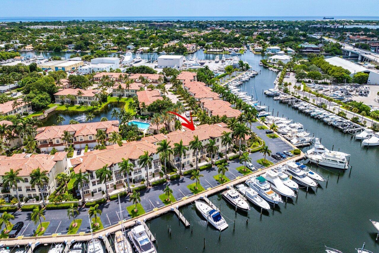 Discover Marina Gardens, an Exclusive Gated Community w/65 Townhomes Nestled along Soverel Harbour Marina. This Luxurious 3-story Waterfront Townhome Offers 3 Bedrooms, 4 Baths, 2-Car Garage & Spacious Bonus Room on 1st Floor, Complete w/Wet Bar, Wine Cooler, Ice Maker & Dishwasher. Enjoy the Convenience of a Private Elevator for Easy Access to Each Floor. 2nd Floor Showcases Expansive Living & Dining Room, En Suite Guest Bedroom,Eat In Kitchen w/Balcony that Opens to Marina, SS App, Sub Zero Refrigerator, Double Oven & Natural Gas Cooktop. On 3rd floor Indulge in Waterfront Master Suite w/His & Her Bath, Large walk-in closet w/Built Ins & 2nd En Suite Guest Bedroom W/Balcony View of Pool. New Roof 2024 & Exterior Painting.  Close to Fine Dining, Gardens Mall, Beaches, Golf, PBI Airpor