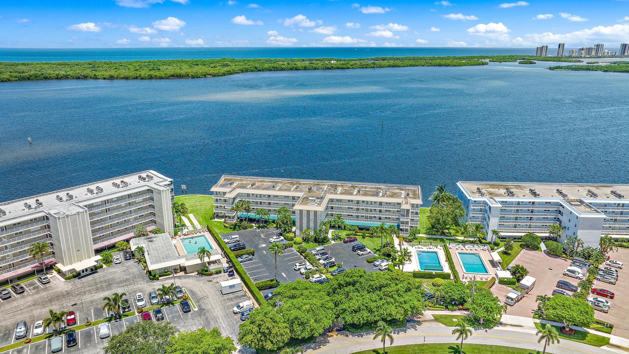 Coastal condo with the most amazing Intracoastal WATER views! Relax and enjoy the gorgeous sunrise each morning, and the beautiful moon light each night, from your stunningly UPDATED condo.  Every day will feel like vacation! You will fall in LOVE with this 2 bed / 2 bath condo from the moment you step inside. The warm industrial vibes make this a unique coastal retreat. Tons of Upgrades! The brand new kitchen includes wood cabinetry, granite countertops, & stainless steel appliances. Luxury Vinyl flooring throughout. Impact Windows. This spectacular unit is move-in ready! Enjoy the pool and social atmosphere of this active 55+ community. Located in North Palm Beach, just minutes to gorgeous beaches, amazing restaurants & fabulous golf.