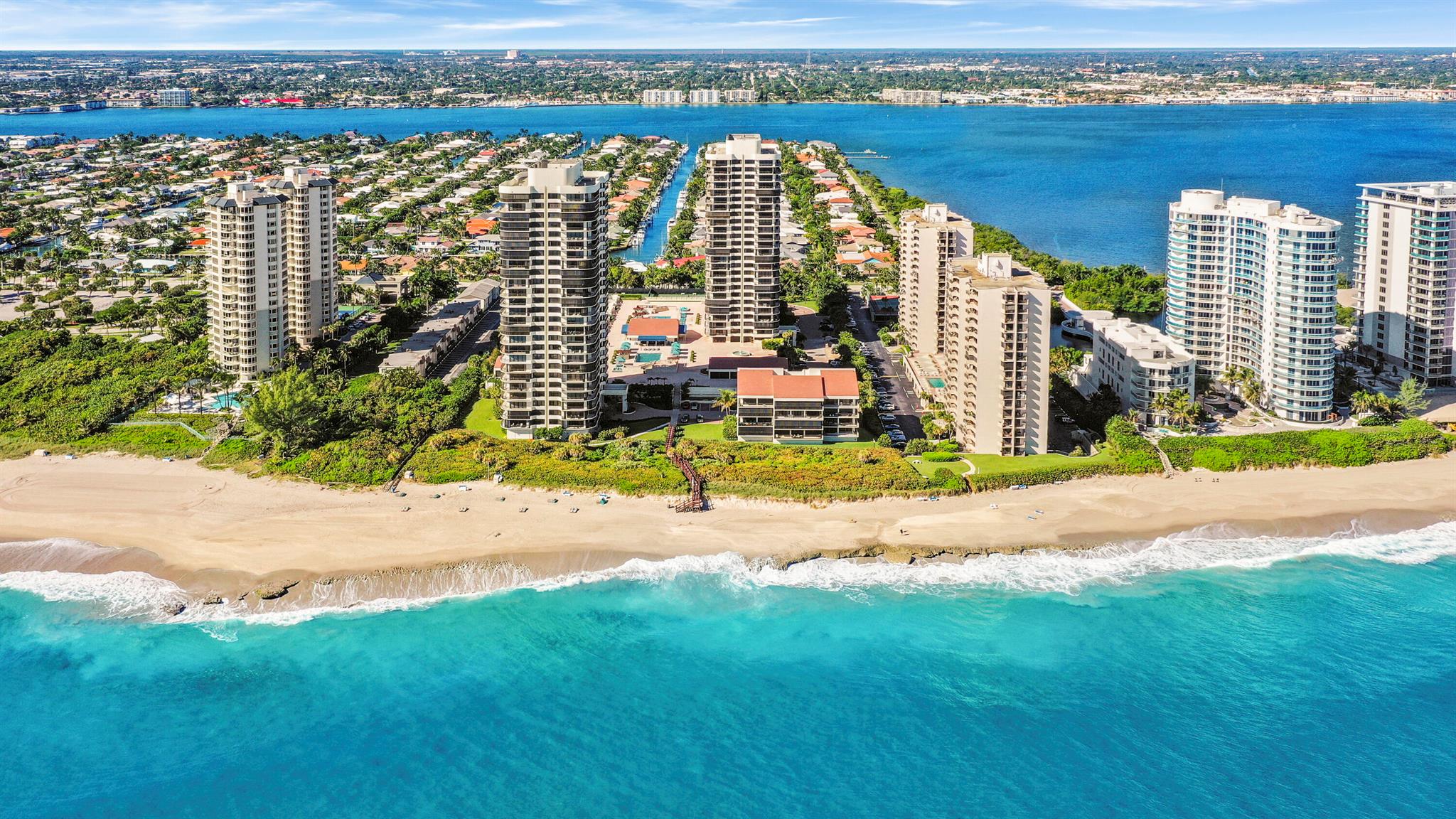 This luxury condo is located in the highly desirable Singer Island community of Martinique II. Enjoy spectacular sunsets from this 2 bed, 4 bath condo. This updated unit features a large living space with two walls of floor to ceiling windows opening onto the wrap around balcony. The large balcony is the perfect outdoor place to relax, entertain and watch those magnificent sunsets. Lots of natural light spills throughout this oceanfront condo and into the bedrooms. Split bedroom floor-plan, the oversized master suite features his and her bathrooms, dual sinks, soaking tub, separate shower, walk in closets and a second private balcony. The oversized 2nd bedroom has its own on-suite, plenty of closet space and balcony access. The Martinique is a 5 Star complete resort style... ... building including a full-service on-site restaurant, social room, billiards, library, fitness center, 2 tennis courts, pickle ball, 2 swimming pools, residence lounge and private beach access. The property has a manned guard gate with 24-hour security and a concierge. This unit comes with 1 garage parking space.