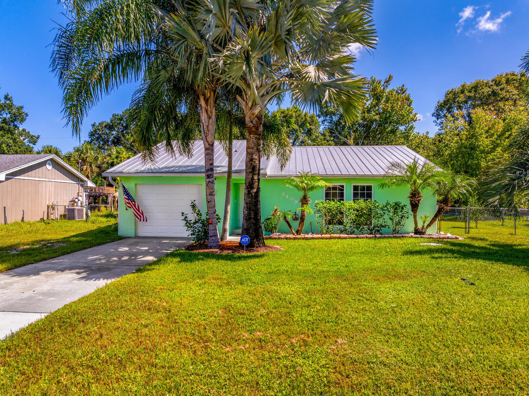 Nestled in the charming community of Lakewood Park in Ft. Pierce, this meticulously maintained 3-bedroom, 2-bath home features a metal roof, CBS construction, AC replaced in 2023 and  water heater replaced in 2022. The updated kitchen features granite countertops and newer stainless steel appliances. An owned water softener system enhances water quality throughout the home. Fully fenced yard Convenient access to nearby amenities, including parks (3 min), winery (10 min), schools, and shopping centers (4 min). 9 min to I-95 and 20 min to the beach!