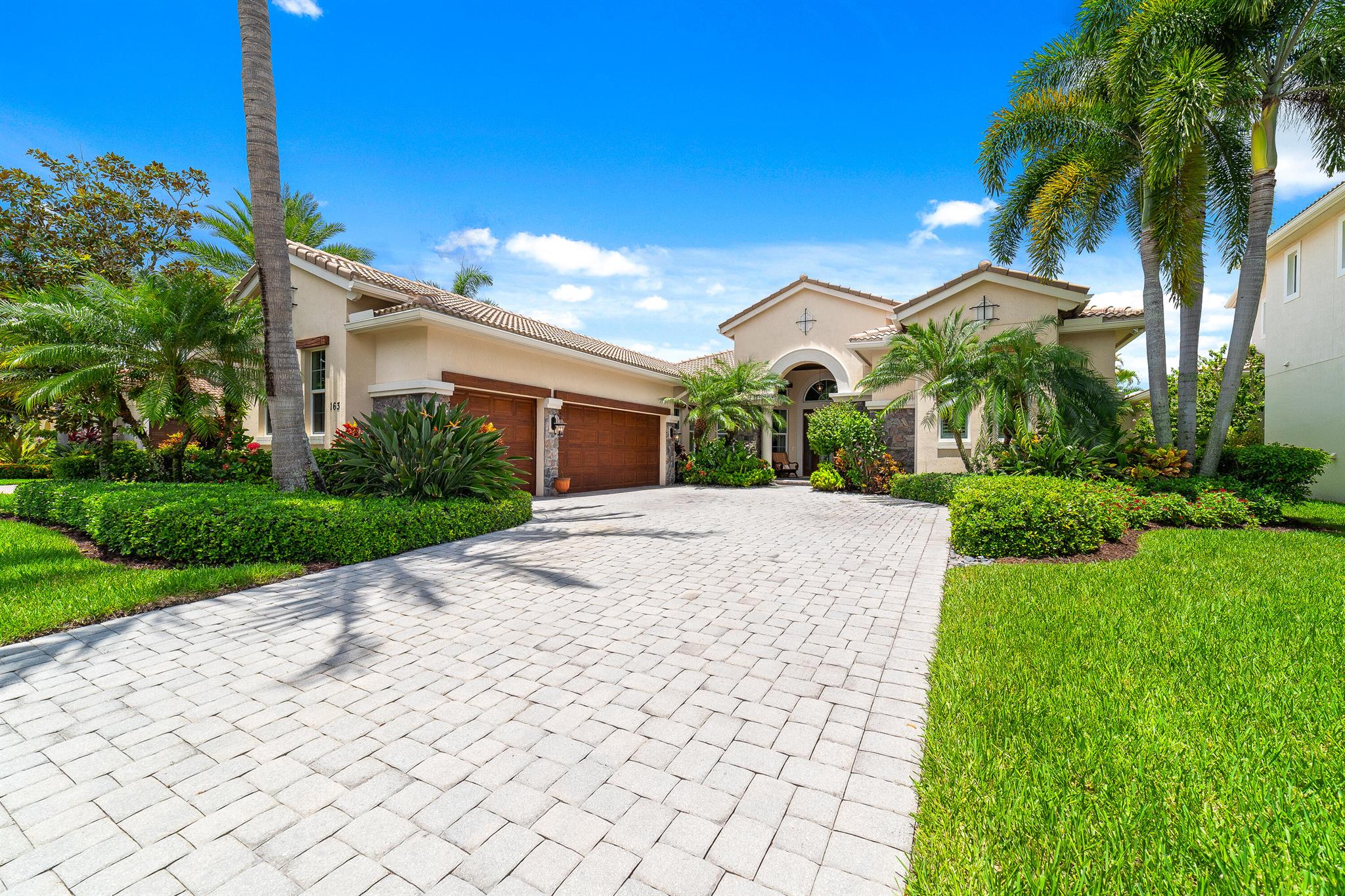 Elegant luxury meets incredible comfort in this magnificent 4 bedrooms plus office / den, 4 bathrooms, LAKEFRONT, POOL home with a 3-car garage in the coveted Jupiter Country Club. ONE OWNER made sure that unparalleled quality and the attention to detail make this home extremely unique - from volume and double tray ceilings, crown moldings, LED recessed lighting, gorgeous travertine marble laid in a diamond pattern, luxury engineered wood in bedrooms, WHOLE HOUSE water filtration system to all IMPACT WINDOWS AND DOORS. The gourmet kitchen is equipped with top-of-the-line stainless steel appliances including a gas stove with a vent, a built-in double oven, stunning granite countertops, glass tile back splash, fabulous custom off-white wood cabinetry finished with moldings, soft-close drawers and a pantry closet. The primary suite offers a lake view and his-and-hers large custom walk-in closets. The luxurious en-suite primary bathroom is completed with splint sinks, a separate tub and shower. All guest bedrooms offer walk-in closets. You'll love the infra red sauna in one of the guest bedrooms. One of the guest bathrooms is a cabana. There is a laundry room with a sink and full-size washer and dryer. Step out and enjoy a serene oasis on the covered and paved patio completed with hi-tech pavers that will keep your feet cool even on a hot summer day. Two HVAC units were replaced in 2023 and 2024. The homes will be painted into a beautiful lighter color in July / August 2024. The HOA provides Hotwire cable and high speed fiber internet, WiFi and security alarm service. This home is a part of the Social Membership, but the buyer can sign up to upgrade to the Full Golf Membership. Jupiter Country Club is a fabulous, exclusive development that offers world-class amenities such as the 18 hole Greg Norman Signature golf course, 2 resort style pools, fitness center, 6 lighted Har-Tru tennis courts, pickleball and caf+¬. The Clubhouse has a restaurant, bar and pro shop. Social membership can be upgraded to a higher tier of membership through the club. Jupiter Country Club is minutes from I-95 and the Turnpike. Take a quick ride to lively downtown Abacoa with many great restaurants and shops, and Roger Dean Stadium. It is conveniently located to grocery stores, shopping plazas, and the newly developed Alton plaza, and just about 15 minutes away from the beach and Jupiter Carlin Park. Whether you want to spend a day at the Busch Wildlife Sanctuary, or an evening in the popular Harborside featuring fantastic waterfront restaurants, boutique shops, live entertainment, or go to a movie theater, it won't take you long to get there. All measurements are approximate. Take a look at the 3D virtual walkthrough.