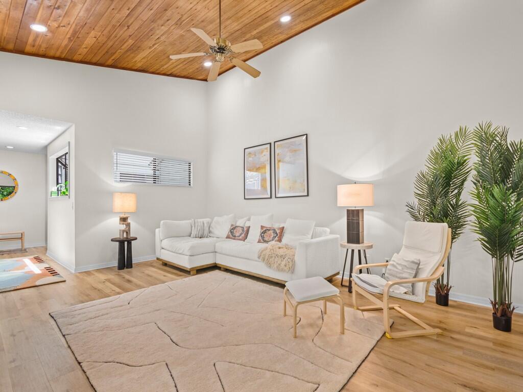 Welcome home to this meticulously upgraded 1,433 sqft end unit, fully furnished and featuring a brand-new 2023 A/C, 2020 roof, and remodeled master bathroom. Enjoy vaulted 14ft ceilings, luxury vinyl plank flooring, and granite countertops in this airy, sunlit space with windows on all sides offering views of lush greenery. Located near I-95 for easy commuting, this special community is affectionately known as 'Treehouses' for its unique charm. Just 6 minutes to I-95, 7 minutes to shopping centers, and 20 minutes to the beach, this furnished home blends comfort and convenience seamlessly.
