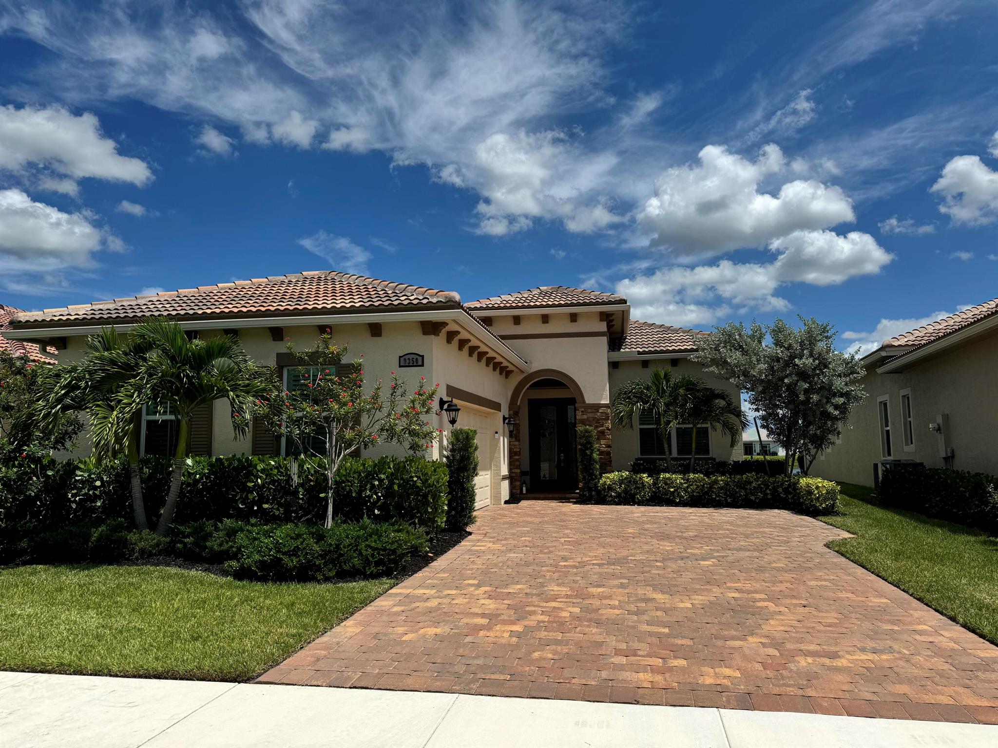 This stunning 2023 Kolter-built Alessa floorplan in PGA Verano, Port St Lucie, offers luxury living at its finest. Boasting 3 bedrooms, 2.5 baths, and a spacious 3-car garage, this lakefront gem features a fenced backyard with NE exposure, perfect for enjoying serene water views. Built for durability with CBS construction, impact windows and doors, and a concrete tile roof, this home ensures safety and low insurance rates. The chef-style kitchen is a culinary delight with a wall oven, chimney hood, and cooktop. Enjoy resort-style amenities and proximity to the 54-hole PGA Golf Club in this exclusive community. Your perfect blend of elegance and functionality awaits! Situated adjacent to the renowned 54-hole PGA Golf Club