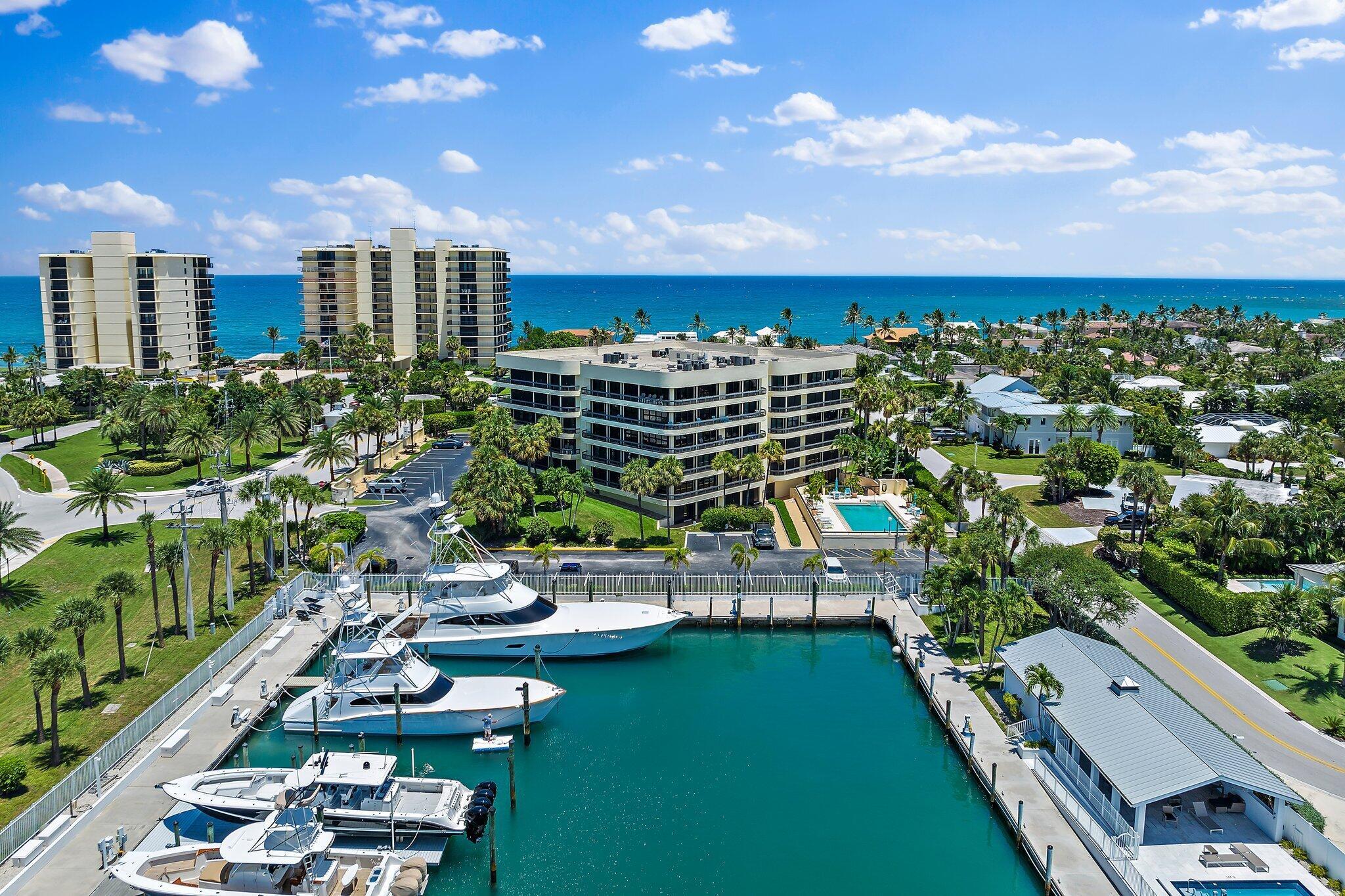 Location Location Location!  JIB Club Condo (Jupiter Inlet Boating Club) is a boutique building and is one of the most sought after buildings with only 20 units that rarely come on the market. Nestled within the  picturesque JIC marina, this spacious 3 bedroom, 2.5 bath condo offers an unparalleled blend of tranquility and luxury. From the spacious balcony, residents can enjoy stunning views of the marina and iconic Jupiter Lighthouse.  The living is  elegantly designed with 8 sets of sliding glass doors that invite ample natural light and provide ever-changing aqua waters of the intracoastal.  Across the street is a deeded path leads to pristine ocean beaches where you catch a dolphin sighting or a sea turtle hatching.  This condo offers an ideal haven for those seeking a harmonious