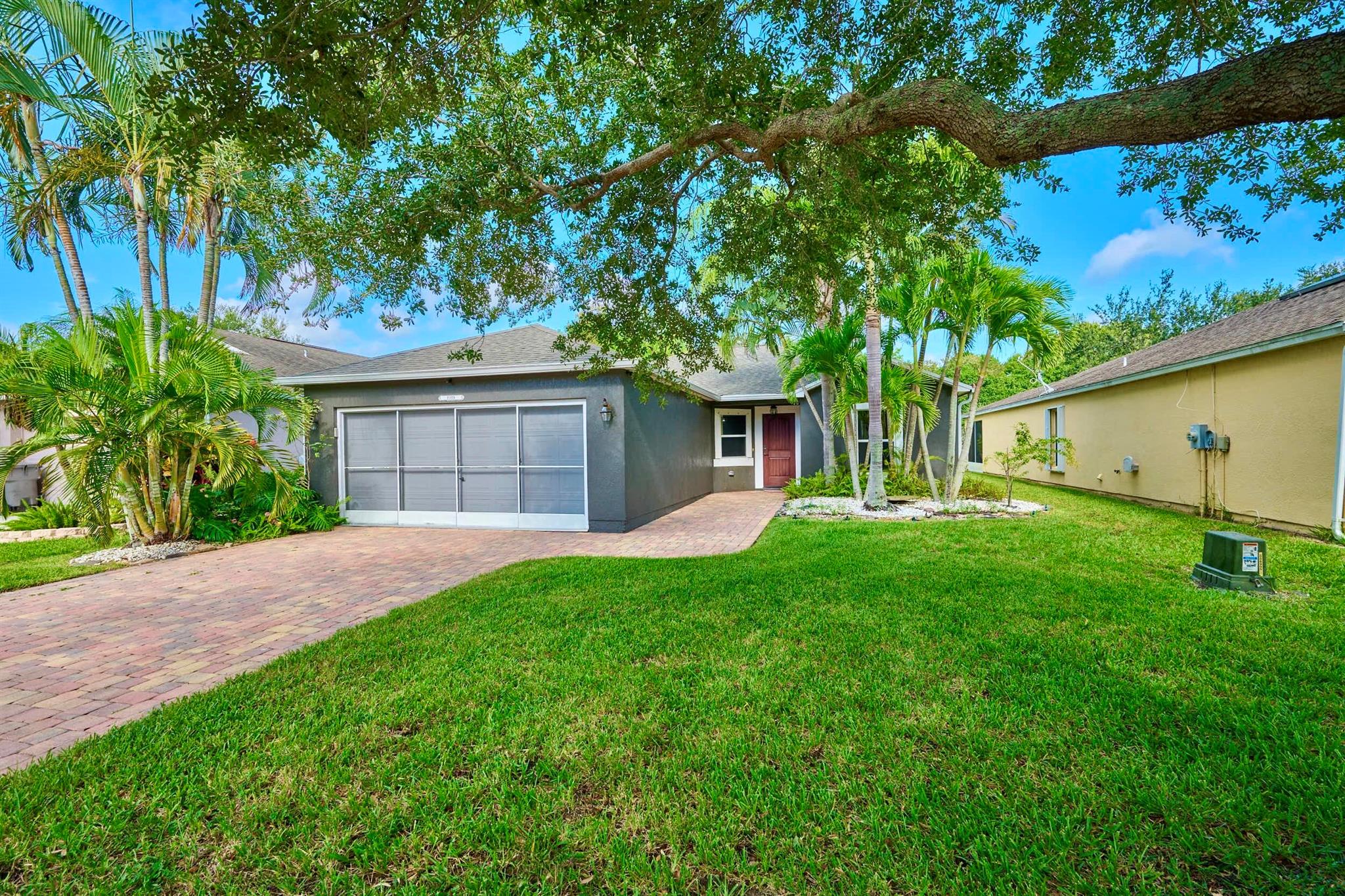 This beautifully updated 3/2/2 home can be yours to enjoy year-round or serve as your Florida Pied-a-Terre. Nestled in the desirable tree-lined neighborhood of Waterford Lakes. Upgrades include: 2024: 5'' base molding and new RICH SLATE TILE FLOORING throughout including Lanai and out to Zgarden. 2022: d/w, microwave, 2018: ROOF and KITCHEN! 2017 w/d, 2016 whtr, 2015 HVAC. Home features open floor plan, cathedral ceilings, large owners suite w/ensuite bathrm and large walk-in closet, plus split bedrooms. EXT: 2015 Pavered driveway, walkway. Two-car garage complete w/Tinker Screen and plug for generator. Barn Doors open out to bright Zen garden views w/white privacy fence. Community features sidewalks, pool and playground. Landscaping is included in low monthly HOA. MUST SEE VIDEO TOUR!!