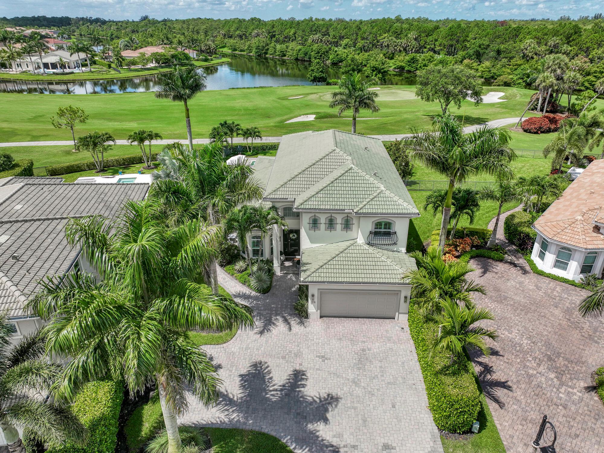 This exquisitely designed 2019-built home offers breathtaking lake, golf & preserve views from one of the best homesites in the resort style gated community of Jupiter Country Club. This rare Saviero model is one-of-a-kind and has 4 bedrooms, 4 baths plus a flex room/den. The prime cul-de-sac location within the community provides sweeping tree-lined views of Riverbend Park, the winding lake & the 11th green. Live comfortably in this energy efficient home with CBS construction, natural gas, reverse osmosis water filtration system in kitchen, and impact glass windows & doors throughout. The newly replaced custom impact glass front door and voluminous two story ceilings welcome you into the open concept great room with immediate backyard views through the wall to wall windows. Professionally designed &amp; customized from top to bottom, this home exudes modern sophistication and provides all the essentials of easy Florida living. You will see the high quality finishes and attention to detail flow throughout the home. Stunning light fixtures are throughout the home. No standard finishes here! Rest peacefully in the primary retreat where the original floor plan was modified to encompass a downstairs guest room and transformed into the primary spa-like bath &amp; expansive modern custom closet. Friends &amp; family will gather at the kitchen's expansive center island featuring a waterfall quartz countertop &amp; pendant lighting. Kitchen upgrades include gorgeous white solid wood cabinetry with glass panels, pull out shelving, tile backsplash, built-in refrigerator, 5 burner gas cooktop &amp; double ovens. The flex room/office and a full bath are located downstairs. 3 guest bedrooms are upstairs-all bedrooms have walk-in closets with built-ins &amp; 2 have ensuite baths. Step out through the great room's sliding glass doors into the outdoor oasis. Surrounded by mature palm trees and tropical landscaping, this area boasts a covered lanai, motorized retractable screens, a lovely pool &amp; spa with a sunshelf and the most serene preserve, lake and golf course vistas. Sunsets are enchanting from this relaxing outdoor living space perfect for lounging &amp; entertaining! This home can be purchased turnkey furnished including a golf cart. Jupiter Country Club is a luxury gated community conveniently located within close proximity of I-95 and the FL Turnpike, beaches, shopping, restaurants, parks &amp; nature preserves. Club amenities &amp; events offer a plethora of social opportunities and include a Greg Norman Signature golf course, 2 resort-style pools, the Sway restaurant &amp; bar, a state-of-the-art fitness center + yoga/mat pilates/barre group fitness classes, tennis, bocce ball, pickle ball &amp; basketball. Members enjoy reciprocal privileges to Invited Clubs worldwide. Live your best life here!