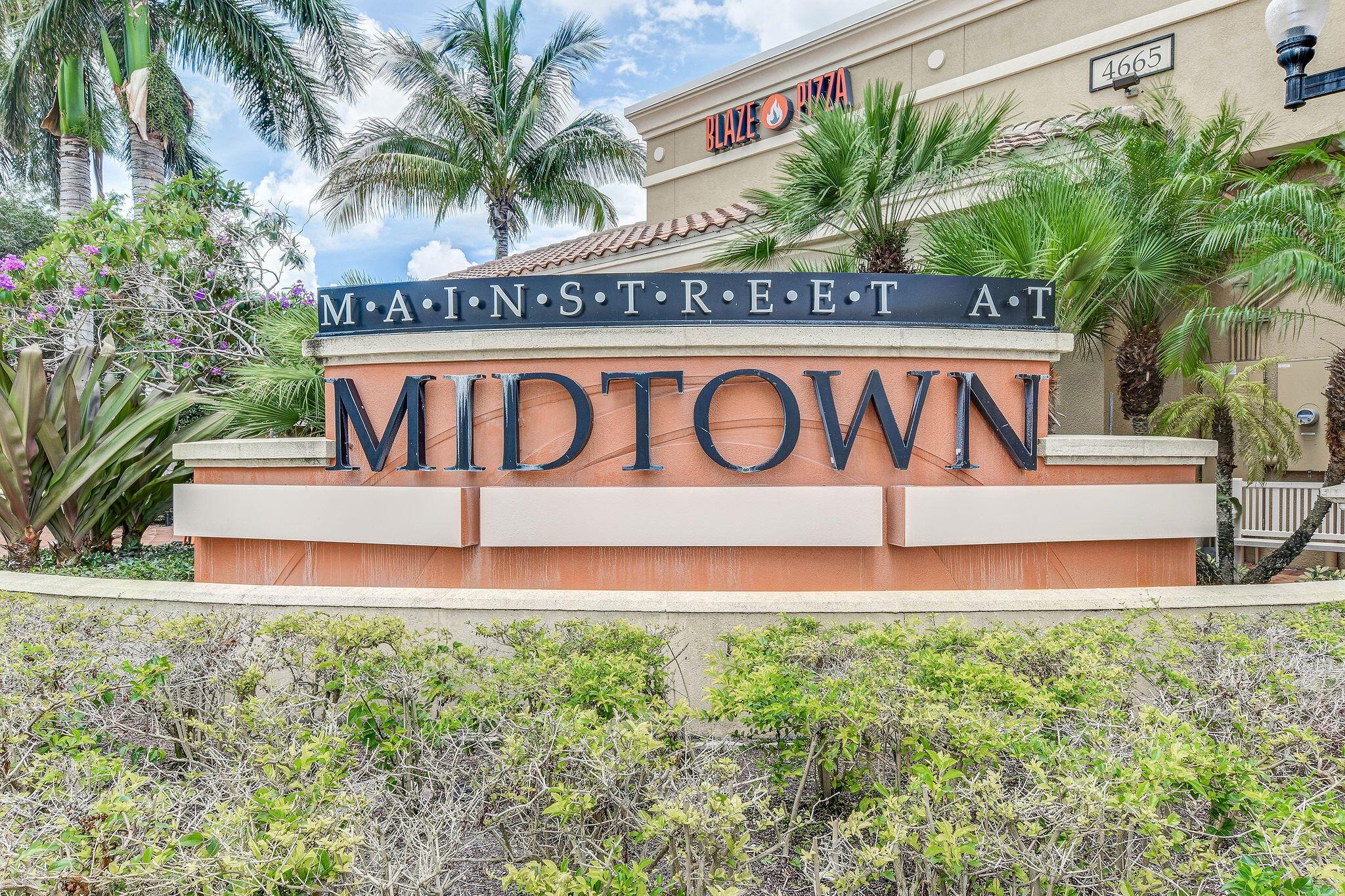 Luxury Living Redefined & Priced Right!  Don't miss out on this rare opportunity to live in the heart of Palm Beach Gardens in Midtown.  Boasting a large 3 bedroom, 3 bath, den/office, dinning room, living room, separate family room, split floorplan, 2 master bedrooms, walk in closets, 2 covered patios, 1 open patio, corner unit with garden and lake views, granite counter tops, SS appliances, wood tile floors through out, 2 assigned spaces garage/outside. Prime location! Residence of Midtown offers a club house, tropical pool and deck, tennis/pickleball courts, tree lined walking path, pet/bike friendly, garage parking, walking distance to restaurants, Fresh Market, Publix.  This prestigious neighborhood offers the perfect blend of luxury and convenience. Schedule your private tour today.