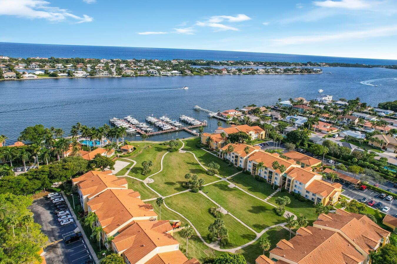 Welcome to your new waterfront retreat at The Yacht Club, where luxury seamlessly blends with coastal living in this delightful 2-bedroom, 2.5-bathroom townhouse. As you step inside, you'll be greeted by an airy open floor plan bathed in natural light, with neutral flooring that fosters a tranquil ambiance. The open kitchen, featuring brand-new stainless-steel appliances and classic white cabinets, serves as the heart of the home, combining style with practicality. Enjoy generous counter space perfect for cooking and casual dining at the convenient snack bar