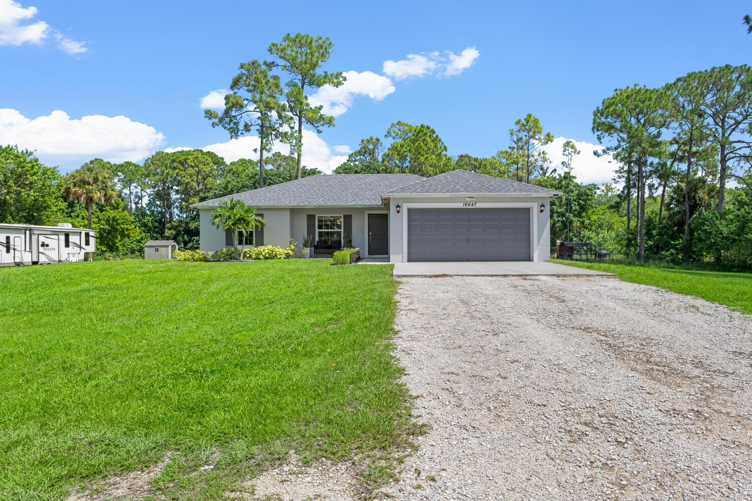 ''REDUCED! $15,000.00'' Welcome to this Beautiful 3BR, 2BA Newer CBS Construction Home. Offering a peaceful retreat that sits on a 1.25 acre lot that is fully fenced and  NO POND. The main floors throughout the home have upgraded wood look tiled floors. The kitchen showcases Shaker white cabinets with Quartz countertops, stainless steel appliances and a large white farm sink. Impact window. throughout and french doors. The home has been set up with a complete RO water system and sprinklers around the perimiter of the home. There are pulldown stairs to the attic for added storage. A split floorplan and open concept in the main living areas. POWERLINES TO THE HOME HAVE BEEN BURIED BY FPL.