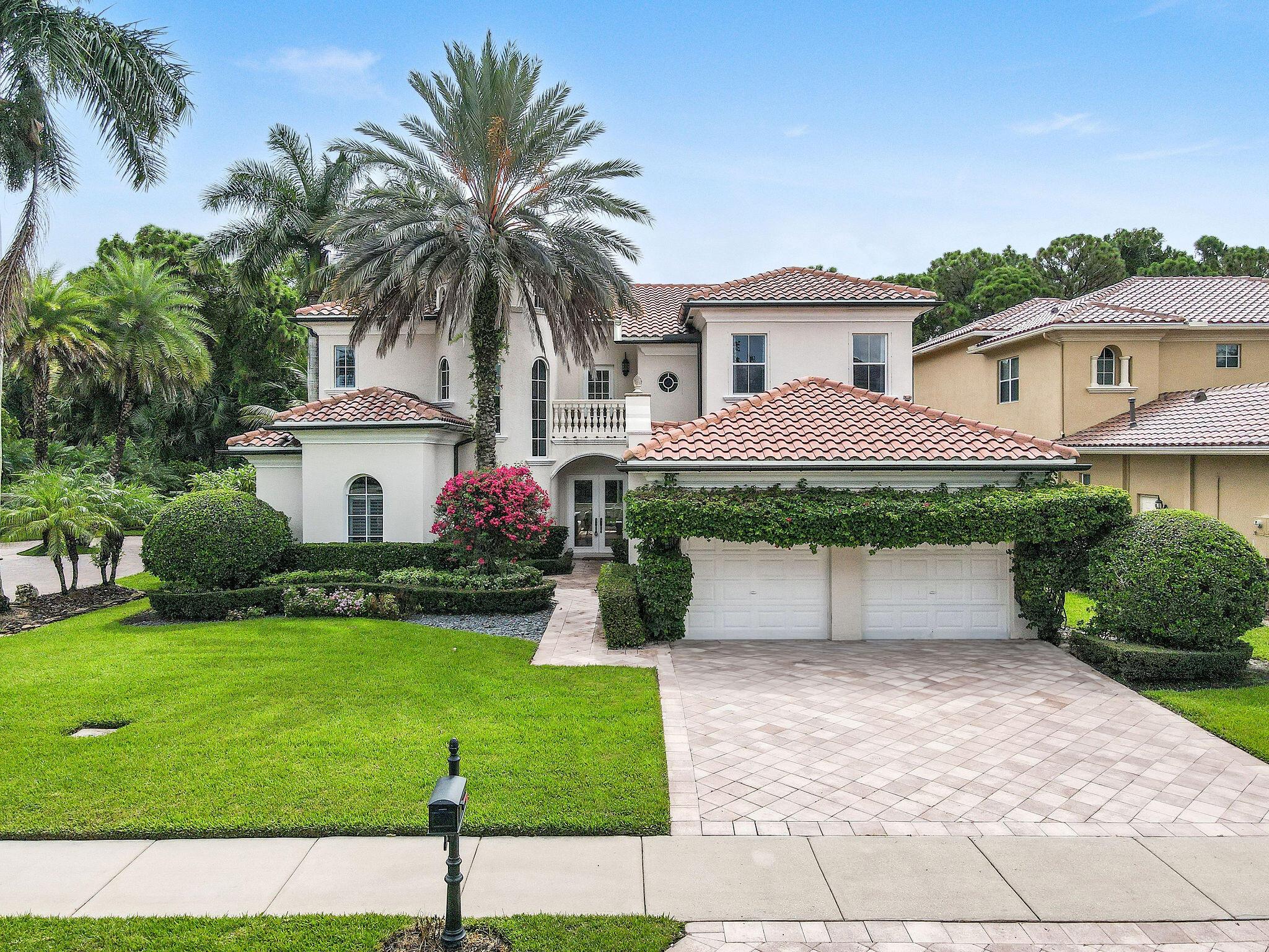 Set on a private corner lot, this stunning residence represents the pinnacle of luxury living, featuring an array of high-end amenities and finishes. From the moment you arrive, vaulted ceilings and a striking marble fireplace welcome you, complemented by new hardwood flooring that enhances the home's bright, airy feel. The renovated kitchen boasts a marble backsplash, a gas range, an oversized pantry, and a new wine fridge. The first floor showcases a tranquil master suite designed for comfort and convenience. This suite includes spacious California walk-in closets, providing ample room for organizing clothing and personal items with ease. Additionally, the layout features a versatile den or office space, ideal for use as a quiet work area or a cozy retreat for relaxation. Upstairs, you'll find three bedrooms and two meticulously renovated bathrooms. Enjoy seamless indoor-outdoor living with a covered patio overlooking a heated pool. Additional features include all-new light fixtures, designer window treatments, a new hot water heater, two new AC units, and a new washer and dryer. Located in a prestigious guard-gated community in Palm Beach Gardens, this home ensures security and tranquility. It's just minutes from top dining, shopping, and Juno Beach. Residents benefit from access to a clubhouse, tennis courts, and a sparkling pool. Discover the ultimate in comfort and sophistication that 3158 San Michele Drive has to offer.