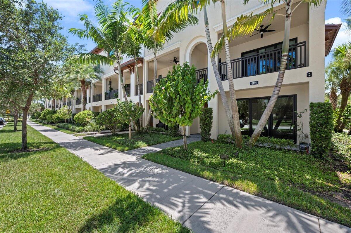 One of a kind corner Alton tonwhome with upgraded metal stair railings, wood stairs and an automatic screen enclosure on your 10X20 balcony facing a neighborhood green space. The 9 extra windows add natural light and along with the 10 foot ceilings they create a living experience more similar to a single family home. The large and open kitchen features an oversized island, 3 walls of cabinetry with quiet close doors, a beverage/wine fridge, exterior vented hood, double oven and high level quartz counters. Added conveniences include motorized shades, oak closet shelves, a rare full soaking tub in the primary bath, HD camera surveillance, intrusion detection system, Ring doorbell and My Q camera keypad garage door opener. Walk easily to both the Alton Town Center and the Club at Alton.