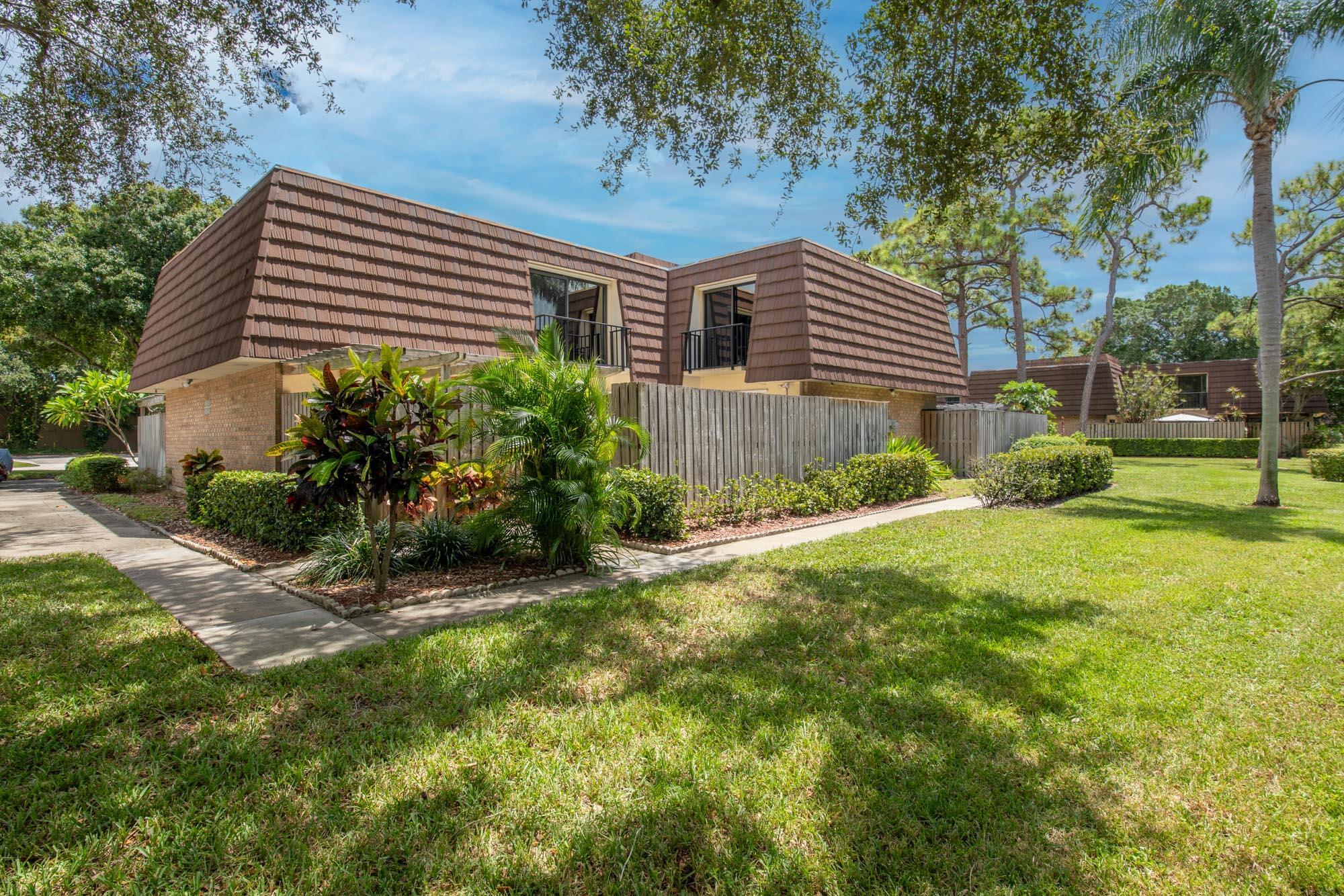 Live your best life in this welcoming 3 bed/2.5 bath two-story townhome in Garden Lakes, a lovely pet-friendly community located in the heart of Palm Beach Gardens situated around panoramic lakes overlooking parks and outdoor amenities including a children's playground, pickleball, tennis, racquetball, and basketball courts. Beautifully updated kitchen with granite countertops and solid wood cabinetry. Relax and enjoy the fireplace in the great room with views of the patio area. The large fully fenced patio is the perfect spot to entertain or sip your morning coffee. One bedroom and half bath are located on the first floor. The primary suite and second bedroom and guest bath are upstairs. Both upstairs bedrooms offer private balconies. Conveniently located within close proximity to