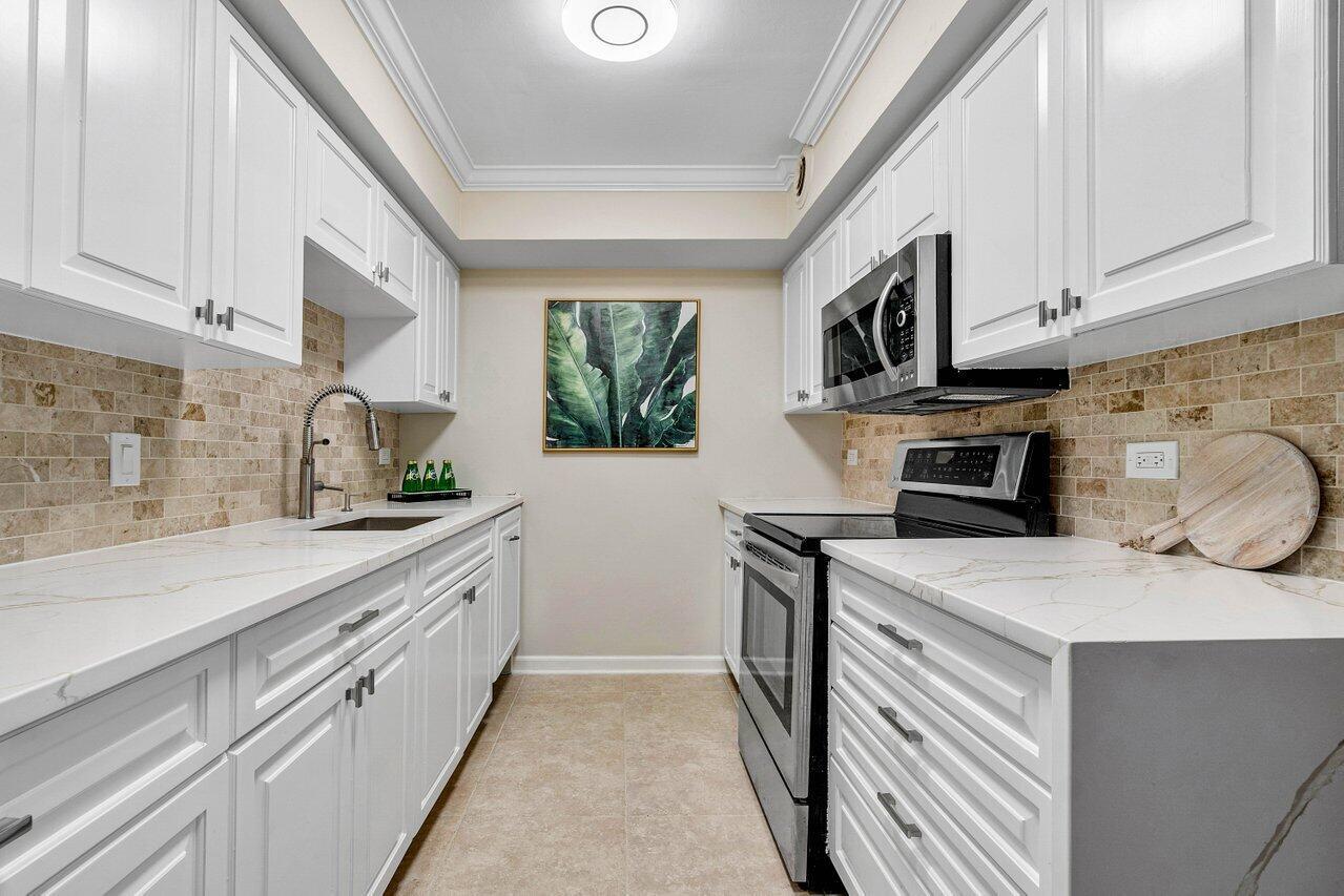 Welcome to 1200 Marine Way, Unit 406, in North Palm Beach, FL! This beautifully updated condo boasts a new kitchen counter, fresh paint, modern lighting, and brand-new plumbing fixtures, enhancing both style and functionality. The bright, open layout provides a perfect space for relaxing and entertaining, while the contemporary finishes offer a touch of elegance throughout. Located in a highly desirable community with fantastic amenities, this unit is the ideal choice for those seeking luxurious waterfront living.  No rentals the 1st year of ownership. After, 1x in a 12-month period for no less than 3 months and no more than 12 months. Buyer can install a washer/dryer in unit if they like. No commercial vehicles or pick up trucks.