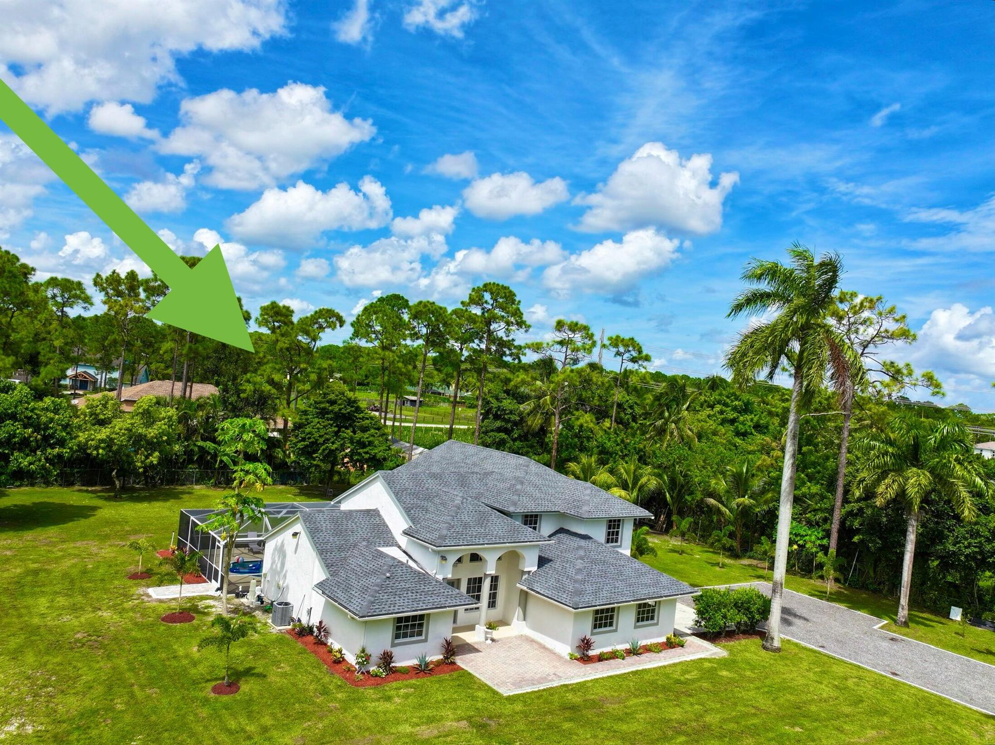 3023 total SQ FT &#9989;**NEW ROOF &#9989;*****paved road  RARE FIND &#9989;** 5 BEDROOM 3.5 BATHROOM  POOL HOME** &#9989; NO HOA** &#9989;1.15 ACRES &#9989;***WELCOME TO 15195 82ND LANE, A SERENE OASIS NESTLED IN THE HEART OF NORTH LOXAHATCHEE, FLORIDA.  THIS EXCEPTIONAL PROPERTY BOASTS 5 SPACIOUS  BEDROOMS AND 2.5 MODERN BATHROOMS, MAKING IT PERFECT FOR FAMILIES AND THOSE SEEKING A PEACEFUL RETREAT *** AS YOU ENTER YOU ARE GREETED BY AN OPEN - CONCEPT LIVING AREA FILLED WITH NATURAL LIGHT , FEATURING ELEGANT FINISHES AND A COZY AMBIANCE ** THE  NEW GOURMET KITCHEN IS A CHEF'S DREAM, COMPLETE WITH STAINLESS STEEL APPLIANCES, AMPLE COUNTER SPACE , HUGE ISLAND  , BREAKFAST BAR THAT FLOWS SEAMLESSLY INTO THE DINING AREA ***.  2 NEWLY REMODELED  EN-SUITE ON 1ST FLOOR  ***. MASTER SUITE WITH S AND HUGE ...WALK IN CLOSET ***. 2ND FLOOR BOASTS 3 NICE SIZE BEDROOMS AND 1 NEWLY RENOVATED  BATHROOM PLUS COZY LOFT AREA THAT CAN BE USED AS OFFICE/ COMPUTER/ EXERCISE / READING AREA ***. STEP OUTSIDE TO YOUR EXPANSIVE BACKYARD, IDEAL FOR ENTERTAINING OR ENJOYING TRANQUIL SUNSETS **. THE POOL AREA IS SCREENED AND CAN HOST MEMORABLE POOL PARTIES *** LOCATED ON A QUIET STREET, THIS HOME OFFERS THE PERFECT BLEND OF PRIVACY AND COMMUNITY, WITH EASY ACCESS TO LOCAL PARKS, SCHOOLS, SHOPPING, ENTERTAINING , BEACHES &#x05; ** GRAB THIS OPPORTUNITY TO OWN A PIECE OF PARADISE !! SCHEDULE YOUR SHOWING TODAY AND EXPERIENCE THE CHARM OF NORTH LOXAHATCHEE LIVING &#x05;&#x05; **. NO HOA- BRING THE RV, BOAT, TRAILER AND PETS !!!