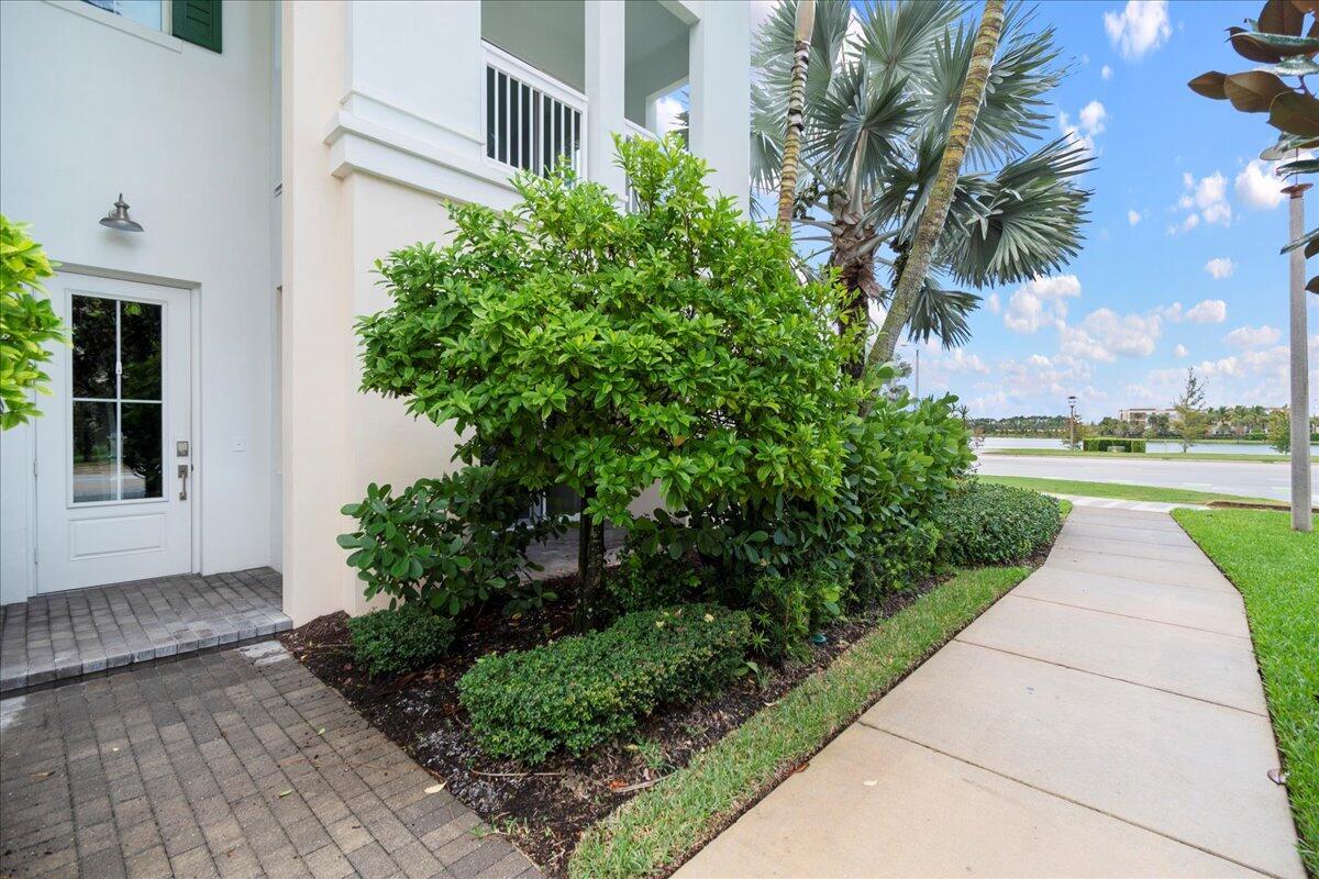 Corner Town A / Bristol  model overlooking the lake to the West for Sunset Views. The 1,122 Sq. Ft. great room and 9ft. x 5ft. kitchen island make this main living area larger than many homes twice the size. End units have 10 extra impact windows with great natural light and this home also has the upgraded metal Key West style roof. Interior features include 10 ft. ceilings with LED lighting and coffered ceilings in the bedrooms for a more elevated feel. 2 balconies plus a private 1st floor patio for outdoor space in addition to the full size 2 car garage. The Club at Alton (0.2 Miles) and The Alton Town Center (0.4 Miles) allow for a truly walkable lifestyle. The Club at Alton features high quality amenities and the Alton Town Center has groceries, dining, shoppes and services.