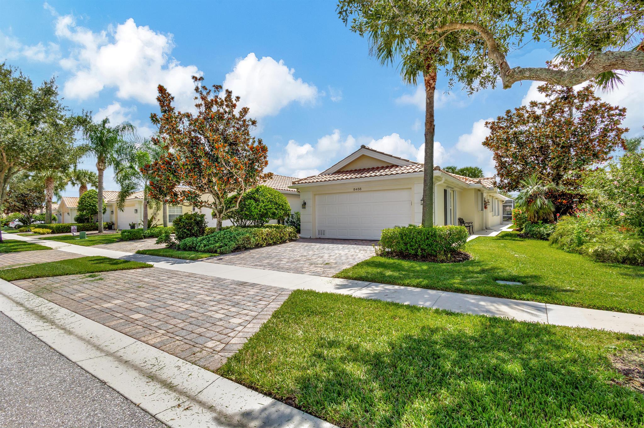 Beautiful waterfront Capri model featuring 2 bedrooms/ 2 baths on one floor. Open, bright floor plan, large hurricane resistant screened in patio with custom flooring and retractable awning. Upgraded kitchen with newer appliances, beautiful quartz counters and custom backsplash. Tile and wood plank laminate floors throughout. Accordion hurricane shutters , Rheem air conditioner only 2 years old. Separate laundry room , 2 car garage. Villagewalk is a very special beautiful neighborhood that offers a fabulous active lifestyle. Cafe, tropical pool, tennis and pickel ball, fitness center, post office, hair salon, Village center and so much more. Landscaping, internet, basic cable and alarm monitoring all included in the HOA fee. Call today for more info. on this special property!