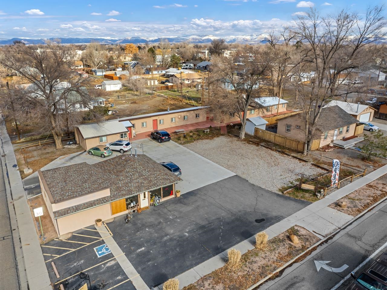 Don't miss out on this incredible investment opportunity in the heart of Fruita, CO! Situated on a prime downtown corner lot, this expansive property offers endless potential for investors. Boasting a spacious 1260 SqFt storefront, currently operating as an antique store, and five additional rental units, this property is a true gem. The five residential units are fully leased, providing a steady income stream, and conveniently share an on-site laundry facility. As an added bonus, this property is spread across several city lots, offering the possibility of future development and expansion. Parking is never an issue, as there are ample off-street parking spaces available in two lots dedicated for both tenants and retail customers. Convenience is key, as this property is just moments away from the Main Circle, community center, schools, and the hospital. Plus, with the grocery store located just across the street, tenants and customers will enjoy unparalleled convenience. To top it off, there is an extra lot of land with no structures currently built, presenting an opportunity for additional development or expansion. Don't let this prime real estate slip through your fingers. Book a showing today and seize this extraordinary investment opportunity!