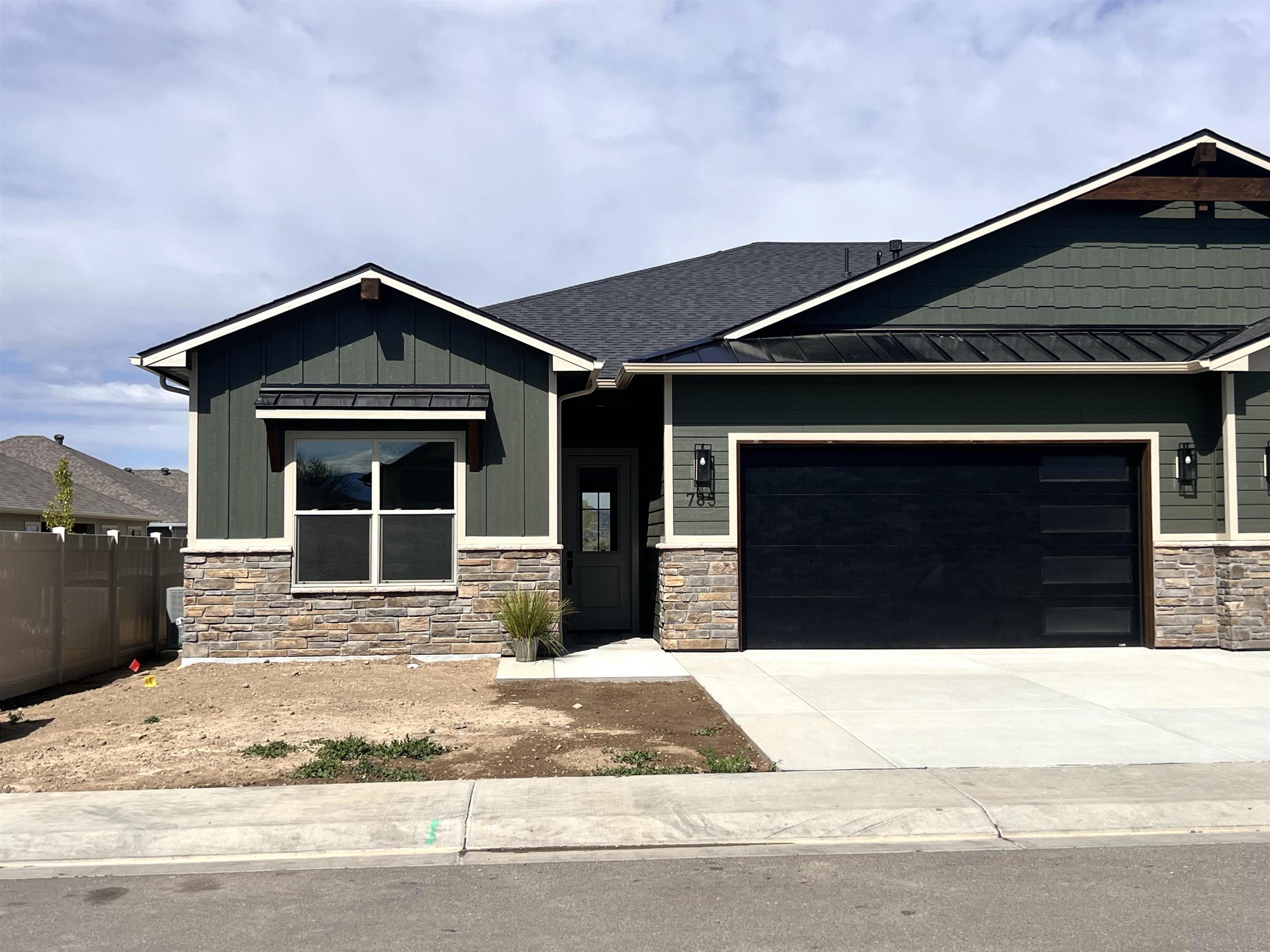 STYLISH, BRAND NEW CRAFTSMAN STYLE HOME in a desirable Northwest area subdivision, walking distance to Appleton Elementary! Ranch style with excellent upgrades throughout! The beautiful quartz countertops throughout, gas range oven, custom designer tile and light fixtures, tall ceilings and doors, make this home a step above the rest, a must see! Small manageable, low maintenance yard make for a wonderful lock n' leave lifestyle.  Enjoy the incredible views of the Monument and the real Colorado Agricultural Lifestyle as this home backs to a horse rescue with open space. High quality build by Canyon Vista. BEAUTILFUL! This is a 1/2 duplex configuration.  Available for quick close or 1031 fulfillment. All info subject to change/error at any time. Buyer to verify.