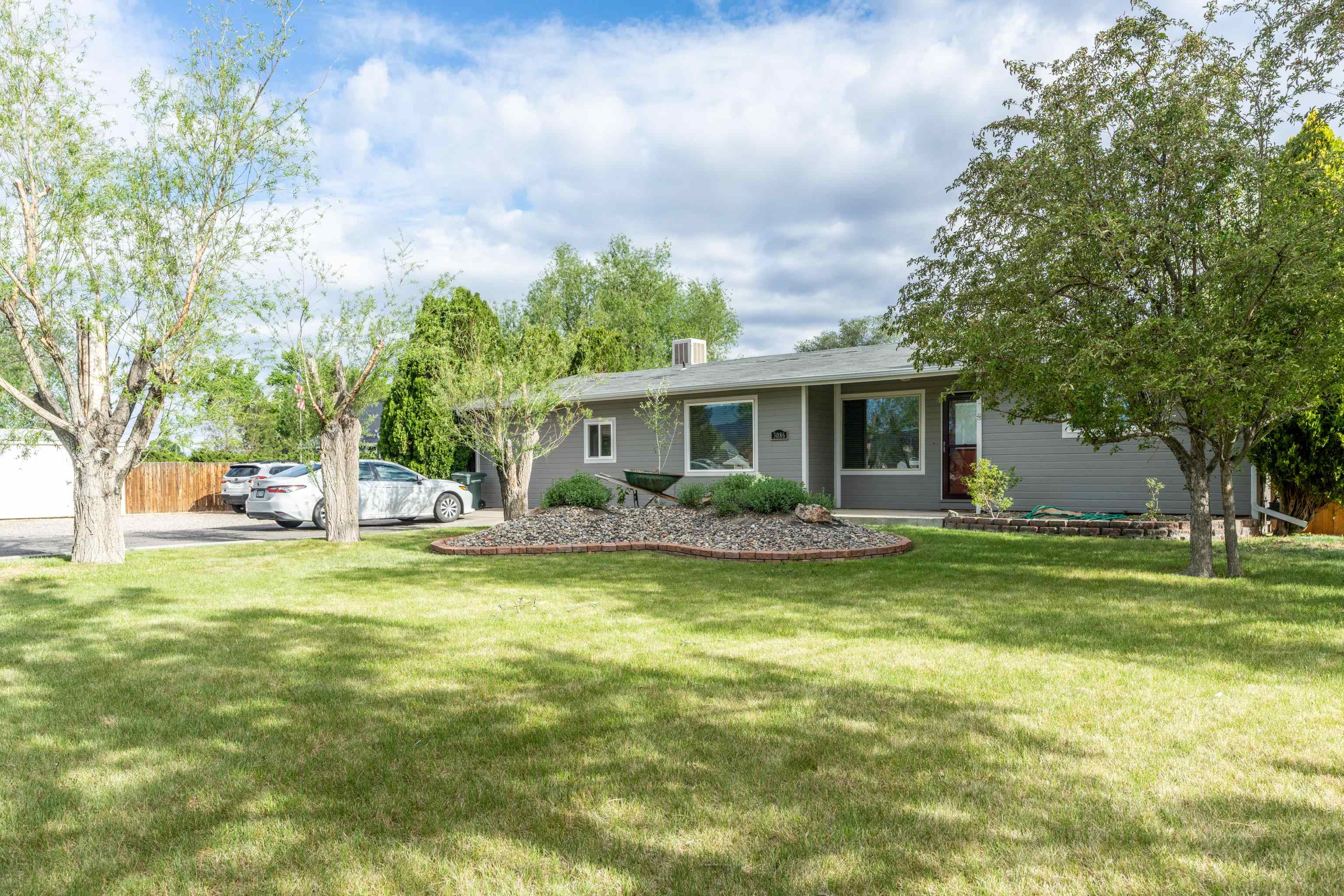 Looking for space for the toys or hobby farm? Bring it all to this cute updated country home with 1.47 acres and detached garage. As an added bonus there's a heated and cooled detached flex room. Home features new roof, energy-efficient vinyl windows, new dishwasher, fresh exterior paint and deluxe chicken set up. Step inside to find tongue and groove accents that bring warmth and style. Potential for Accessory Dwelling Unit (ADU) or subdividing. Country living just 10 minutes to downtown and 1 mile to school and Colorado River Trail system.