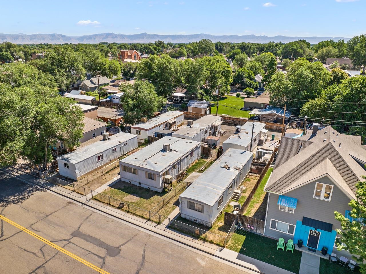 Don't miss this great opportunity! $50,000 price drop. Discover an exceptional investment opportunity just off S Mulberry Street in the vibrant community of Fruita, Colorado! Presenting a rare chance to own a multi-family property with six manufactured homes, this offering is brimming with potential. Unlock the possibilities for growth and enhancement within this versatile property. With five single wides and one double wide, you will be poised to cater to a diverse range of tenants and needs. Whether it's modernizing interiors or enhancing amenities, there's room to elevate the living experience for occupants. Positioned in close proximity to downtown Fruita, residents will appreciate the convenience of city living. From eclectic dining and shopping to outdoor recreational pursuits, the essence of Fruita is just moments from their doorstep. Seize the opportunity to generate rental income while placing your stamp on the charming town of Fruita. Don't let this prime investment slip away. Contact us today to uncover more about this promising venture and schedule a showing!