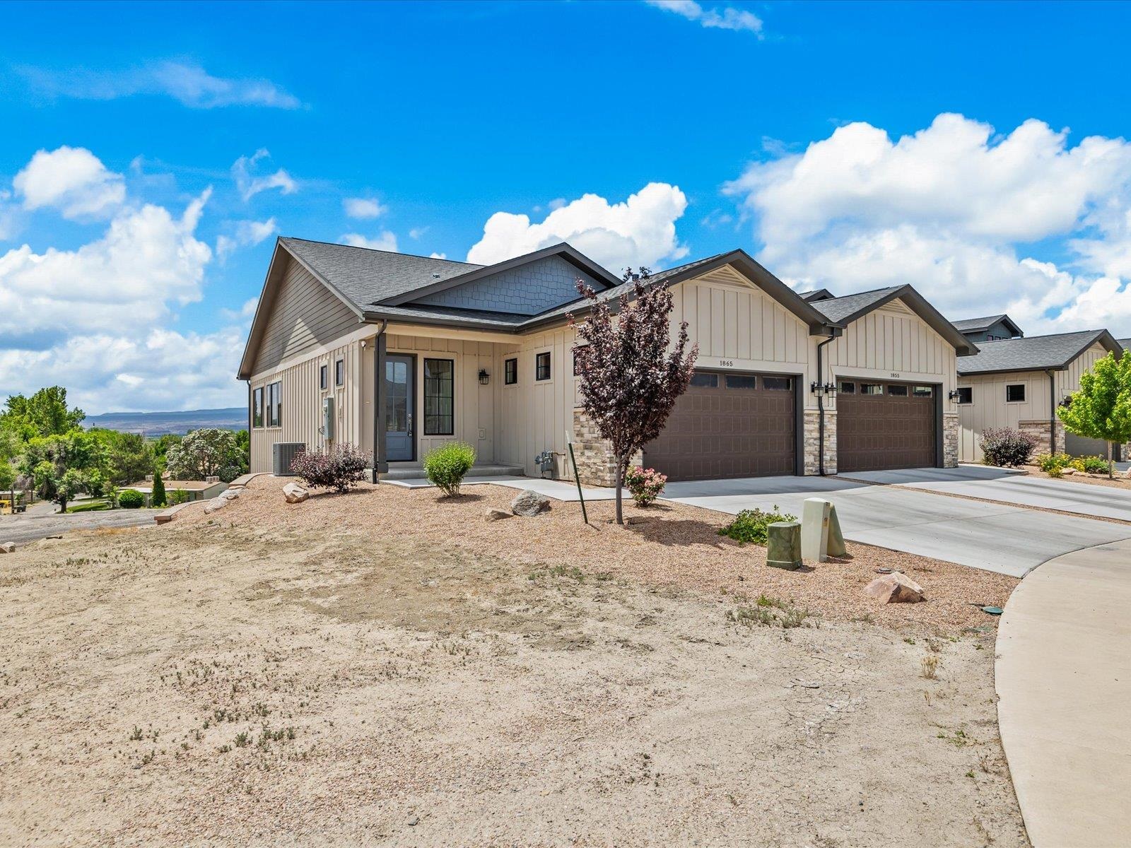 Welcome to 1865 Wellington Ave, a charming residence located in the heart of Grand Junction, CO. This inviting home blends modern comforts with classic appeal, offering a perfect retreat for families or individuals seeking a serene living environment.   As you step inside, you'll be greeted by an open-concept living area that boasts ample natural light, enhancing the spacious feel of the home. The adjacent dining area provides a seamless transition for entertaining and family meals.  The well-appointed kitchen is a chef’s dream, equipped with stainless steel appliances, sleek countertops, and plenty of cabinet space for all your culinary needs. A large island adds to the functionality and charm of this space.  The home offers three generously sized bedrooms, each designed with comfort in mind. The primary suite is a private oasis, complete with a walk-in closet and an en-suite bathroom featuring dual vanities, and a separate shower. The additional bedrooms downstairs are equally spacious, providing ample space for family, guests, or a home office.  Step outside to discover a beautifully landscaped backyard, right on the canal, an ideal space for outdoor gatherings and summer barbecues, and the lush lawn provides a great play area for children and pets.  Additional highlights of this home include a two-car garage and a laundry room with extra storage. Located in a friendly neighborhood, 1865 Wellington Ave is just a 5-minute walk from a grocery store and offers easy access to local parks, schools, the CMU campus, and numerous nearby restaurants. Additionally, St. Mary's Hospital is conveniently only 1.2 miles away.  Experience the perfect blend of comfort, style, and convenience in this delightful Grand Junction home.