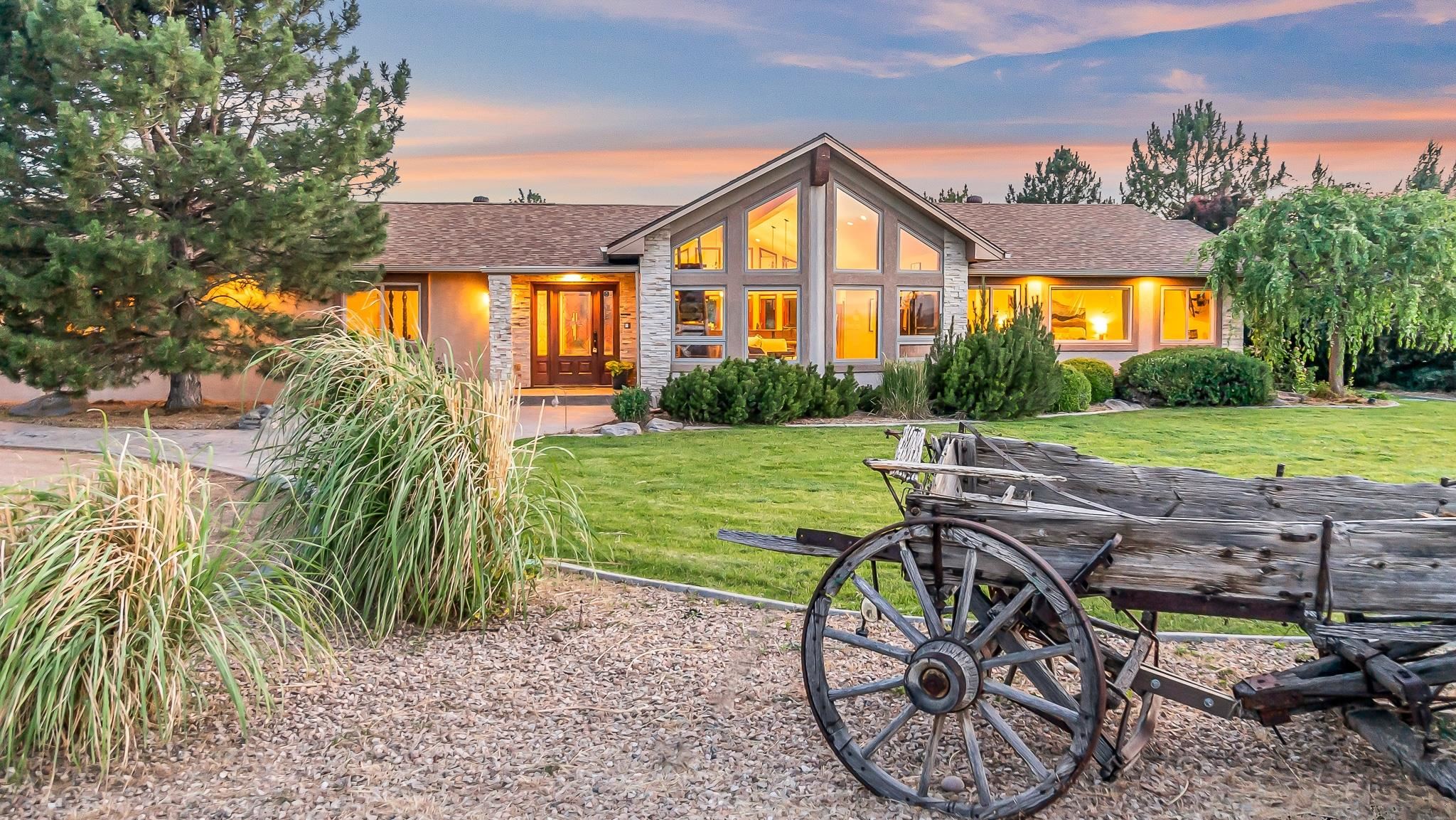 This eco-friendly custom ranch home combines country living with modern conveniences in the heart of western Colorado. Nestled on 5.64 irrigated acres, this expansive estate boasts 3,565 square feet of open living space. Highlights include vaulted ceilings with wood beams, reclaimed hardwood floors, oversized windows framing breathtaking views, solar panels, geothermal heating and cooling, a new roof (2022), and an in-ground heated pool with a waterfall. The home features three bedrooms, an office, a gym, and an attached ADU/in-law suite complete with a living room, kitchen, and private bedroom/bathroom.  Equestrian enthusiasts will appreciate the 60x80 indoor riding arena, fenced outdoor arenas with automatic horse waterers, and multiple paddocks. The barn includes four stables, a heated and cooled tack shed with a bathroom, and large overhead doors for seamless access. Situated close to BLM land, the property offers stunning views of the Grand Mesa and Bookcliffs, embodying the quintessential Western Colorado ranch lifestyle.  Whether you're seeking a primary residence, investment opportunity, or event venue, this versatile estate has it all. Schedule your showing today to truly appreciate everything this exceptional property offers!  Pictures do not do this property justice - schedule your showing today to experience it in person!