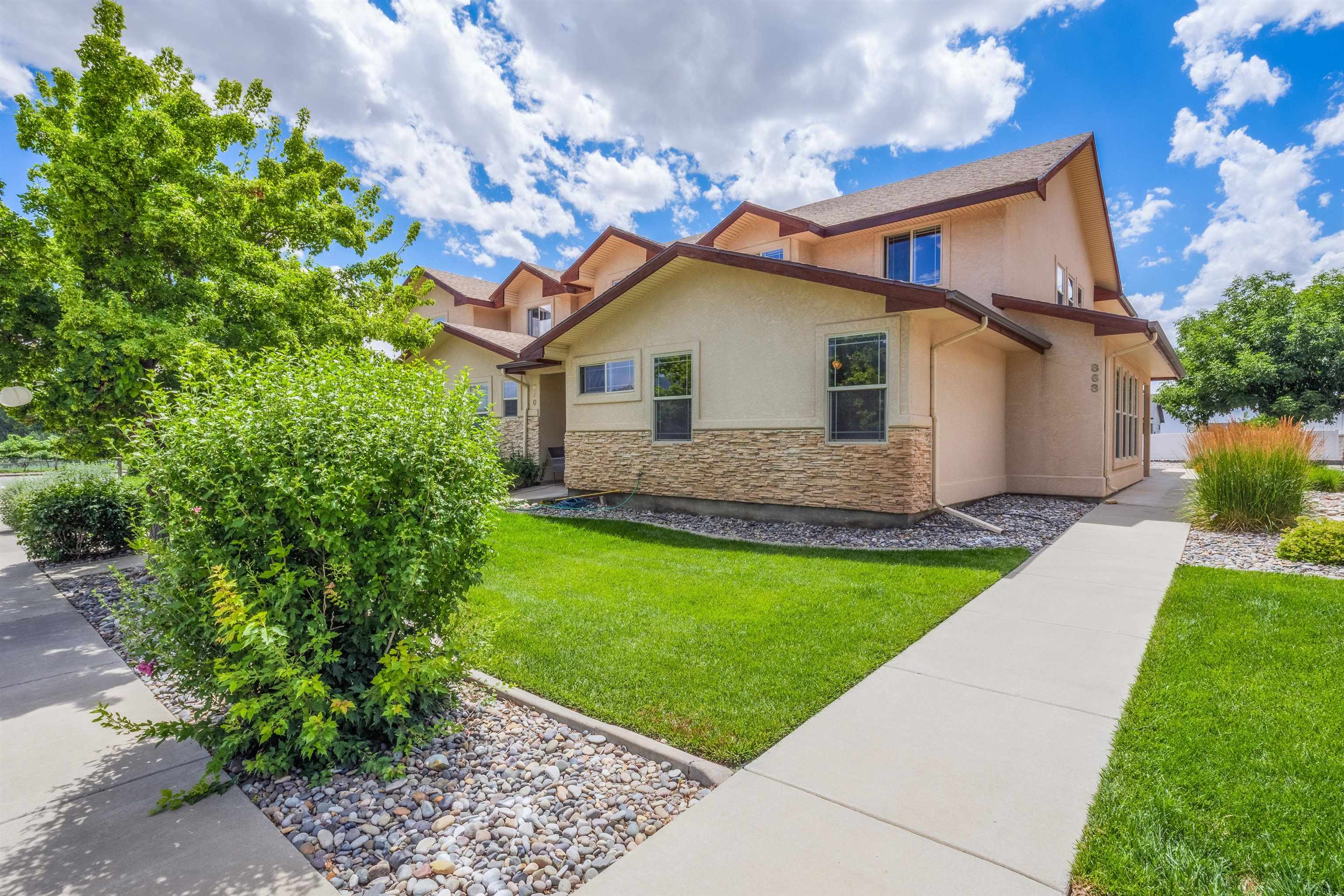 Nestled in the Heart of Wine Country in Palisade Colorado you will find this charming townhome.  Upon arriving you will notice the beautiful views of the vineyard in the neighborhood, the Grand Mesa to your east and the Bookcliffs to the North, then a short walk to the expansive Riverbend Park with gorgeous green landscape.  HOA maintains all yards so you only need to take in the beauty.  As you enter you will find 3 spacious bedrooms and 3 1/2 baths with the Primary on the main and great views of the Mesa and Vineyard.  Open concepts in main kitchen and livings area, with private garage and parking in the rear.  Ride your bike or short 5 minutes trip to your local coffee shop or distillery.  Get in to see this property before it is off the market.