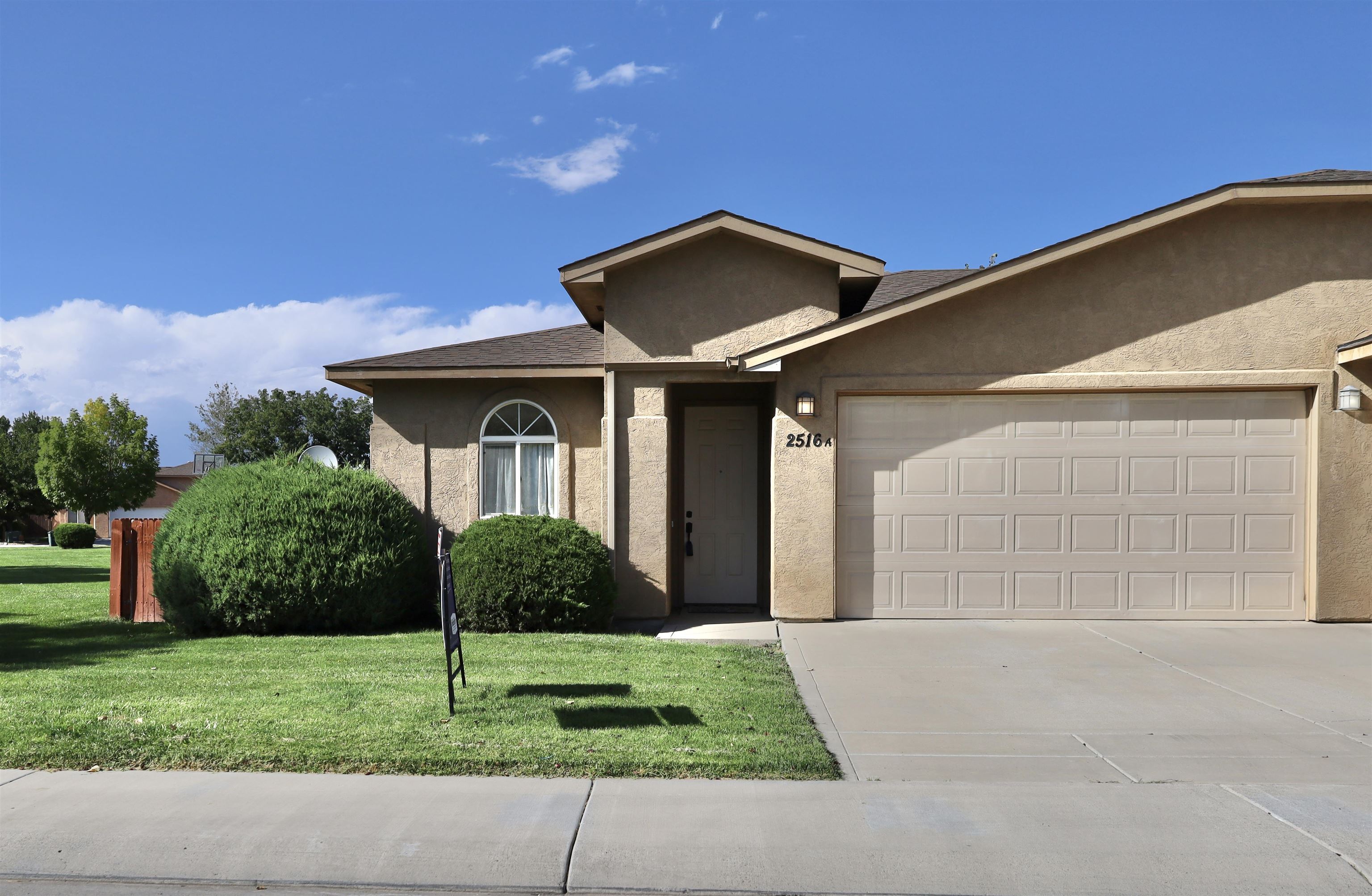 New carpet has been installed! Well-kept 3 bed, 2 full bath, attached two car garage duplex located in North Grand Junction! Over 1,100 square feet and located next to a large open field offering extra space and privacy including a fenced backyard. With a new roof and consistent care this home shows its pride of ownership. Conveniently located near schools, shopping, dining, and more! Vacant and ready for its new owner!