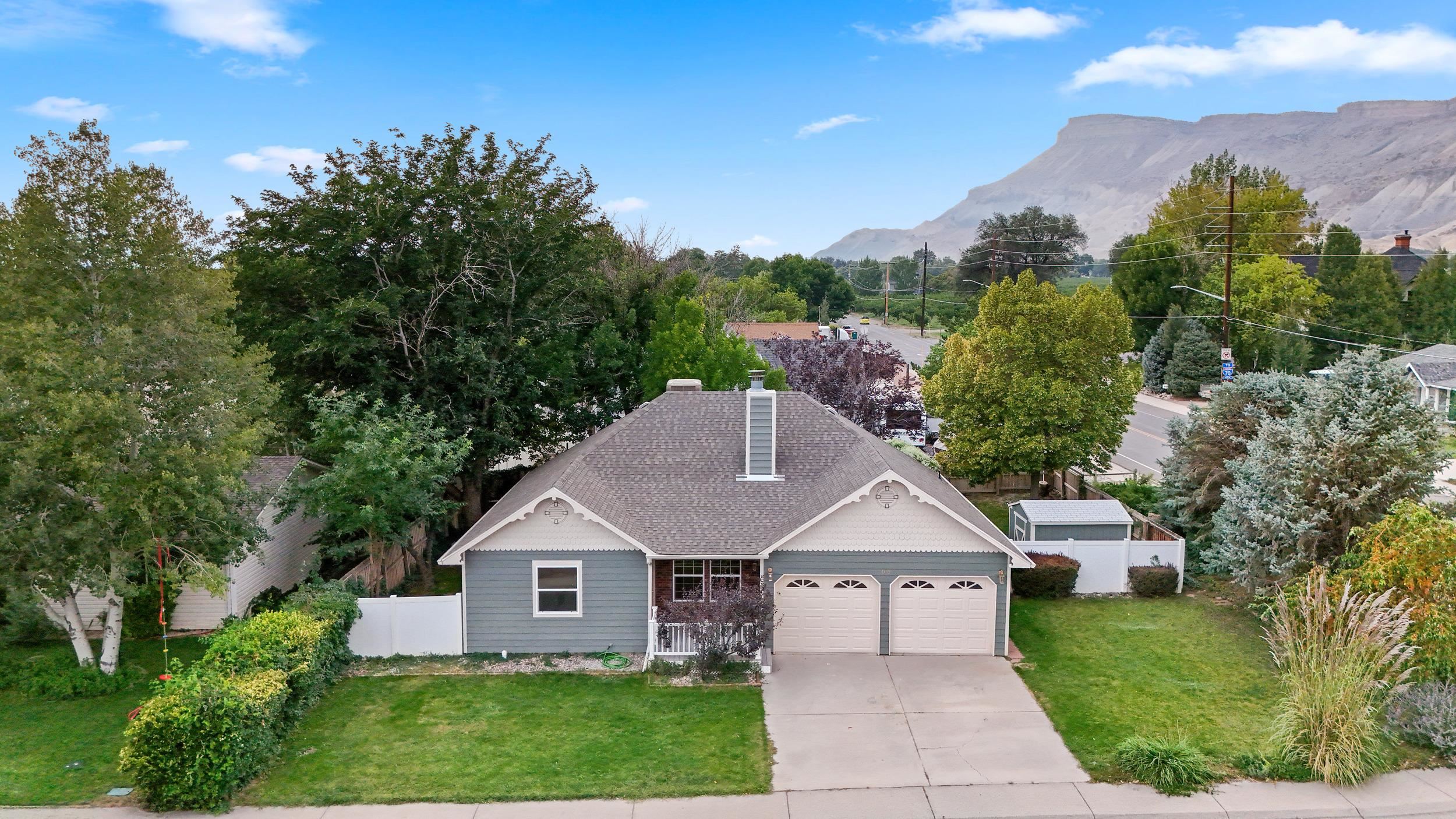 Step into modern vintage with this beautifully remodeled Palisade home! Right in the heart of Downtown Palisade this beauty is just a short walk or bike ride to shops, restaurants and wineries. Enjoy all Palisade has to offer with your turn key dream home. Sage kitchen cabinets, quartz countertops, engineered wood floors, custom tile bathrooms and so much more! This home also sits on a beautifully landscaped lot, with mature trees, shrubs and vines. Enjoy views of the book cliffs while sitting on the covered front porch. Don't let this one pass you by, Call to set up your private showing today!