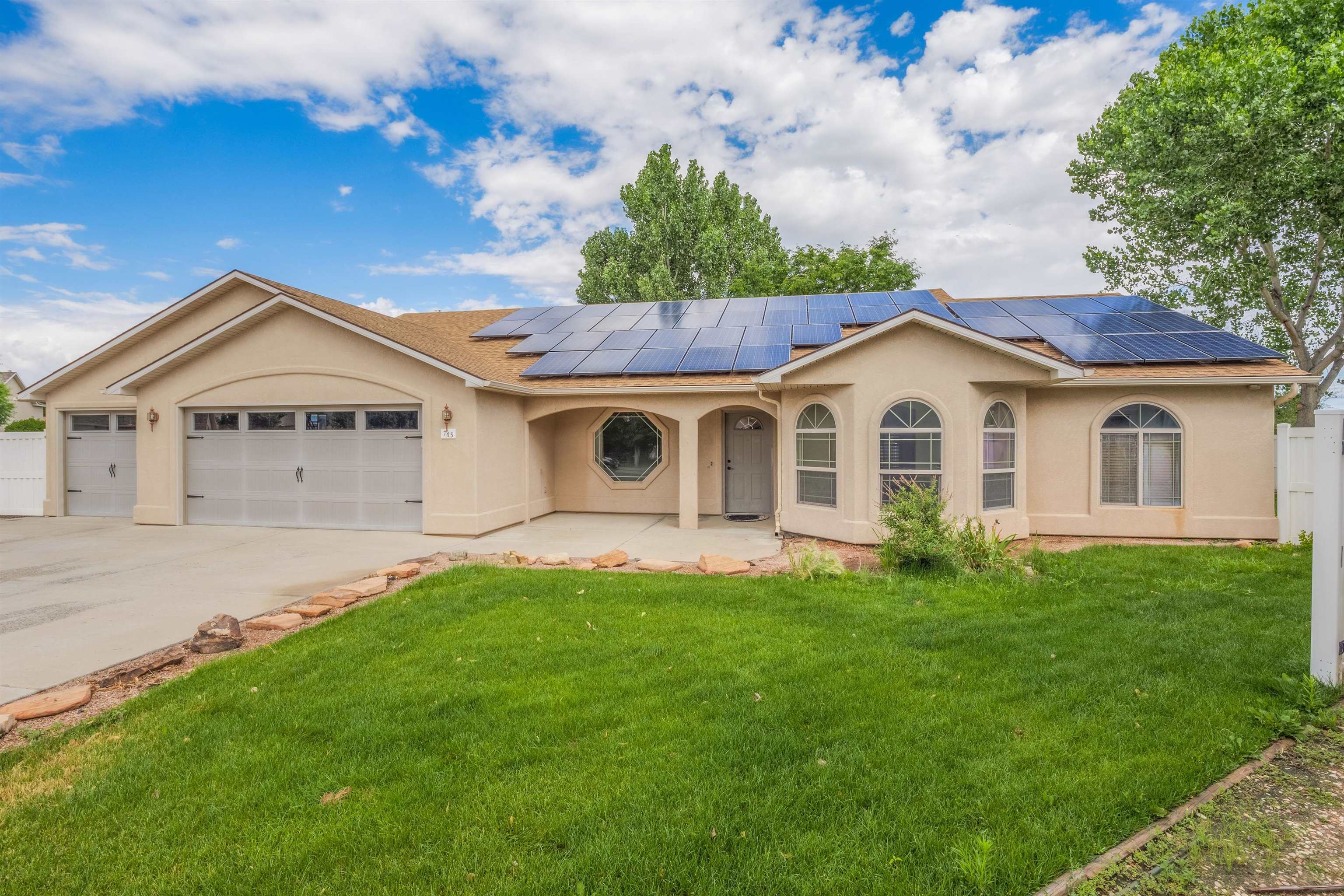 Welcome to your dream home in the heart of Fruita! The entire inside of the home has been freshly painted and new carpet installed throughout. This stunning stucco ranch-style residence offers a perfect blend of modern amenities and small-town charm. The home features a spacious 3-car garage, providing ample space for your vehicles and storage needs, as well as a dedicated workshop ideal for DIY projects, hobbies, or additional storage. There's convenient RV parking, ensuring your recreational vehicle has a safe place to stay. The large yard is perfect for gardening, entertaining, or simply relaxing, and the installed solar panels make the home eco-friendly and energy-efficient, helping to reduce utility costs.  Situated in a friendly, close-knit community, this home provides easy access to local schools, parks, and shopping. Don't miss out on this unique opportunity to own a piece of Fruita's charm! Contact us today to schedule a viewing!