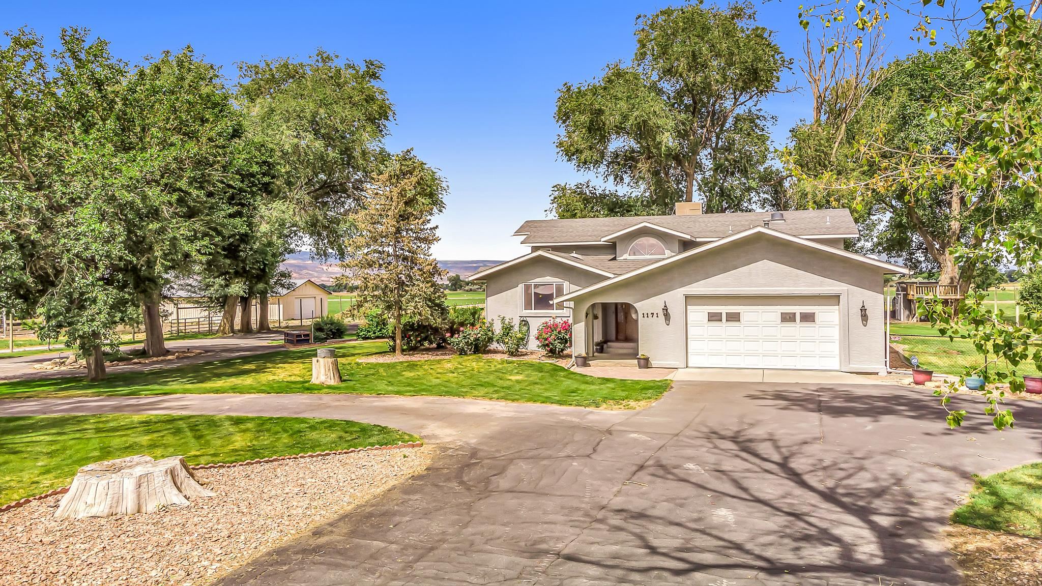 2 homes on 5+ acres. This Northwest Grand Junction/Fruita area home is exactly what you have been looking for.  The amenities are impressive including the main house of 3,520 sq. ft. with a great floor plan.  It is comfortable the moment you walk in.  The living space offers a living room with a gas fireplace and views from every window along with a big kitchen, breakfast bar and dining room.  The primary suite has an attached office, bath with double shower heads and walk in closet.  The 4th bedroom could also be used as a family room.  The deck off the main living area is stunning with views in every direction for outdoor enjoyment.  The 2nd home or ADU is newly complete and includes 1,632 sq. ft., lovely finishes, and a fenced yard.  The shop is 40' X 42' with a 14/ overhead door.  It will be a great workshop and room for all your toys.  RV parking and a horse set up compete this fantastic property!  And did I mention views?!?