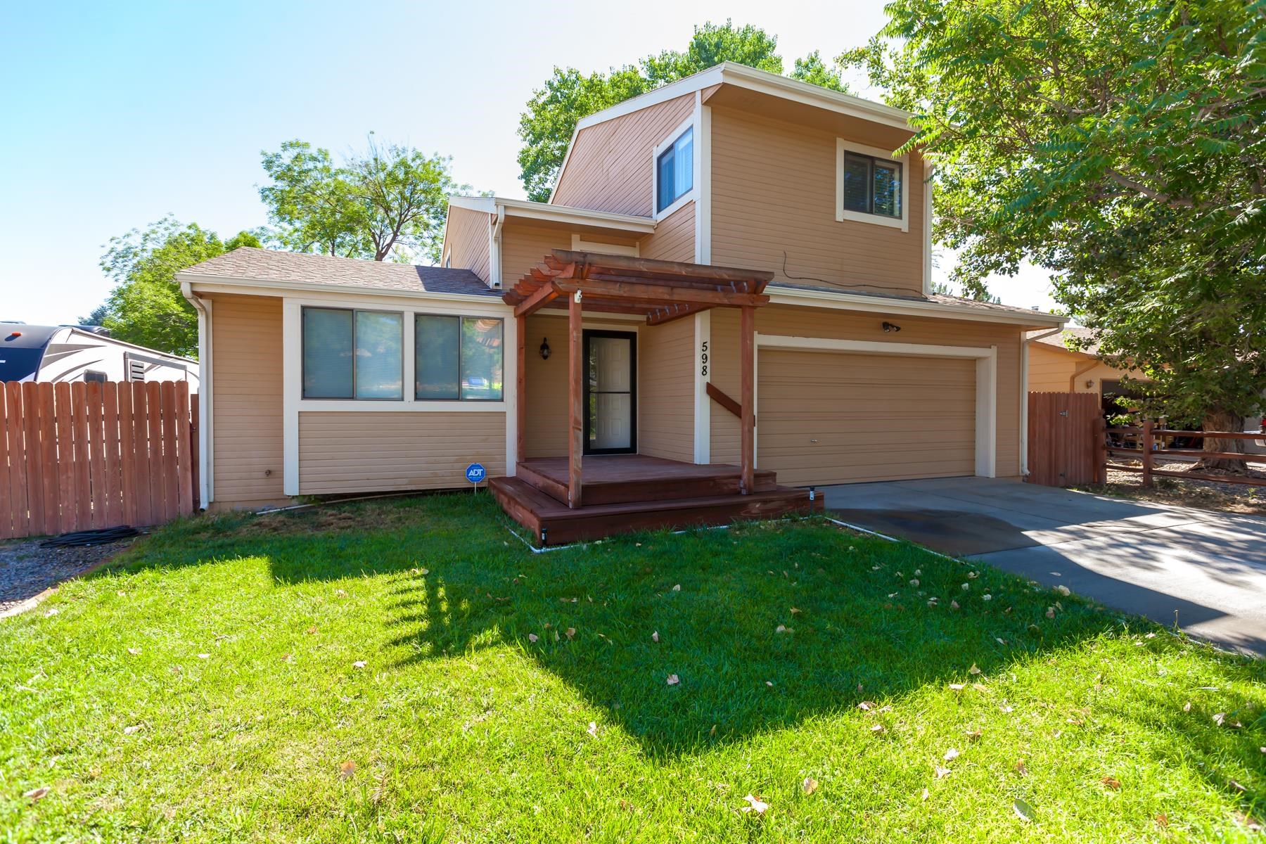 Welcome to your multi-level home in a fantastic Redlands neighborhood. This spacious residence boasts four bedrooms and three bathrooms providing ample space for a growing family.Use your imagination for the additional two non-conforming rooms - craft room, workout room, etc.  The property features RV parking, perfect for adventures, chicken coop, and a convenient storage shed for all your storage needs or workhop.  In summer, enjoy the screened in porch and deck areas. Inside, you'll find new carpeting and laminate flooring throughout, complemented by customized paint that adds a personal touch. This home is perfect for those seeking comfort, convenience, and a welcoming community.