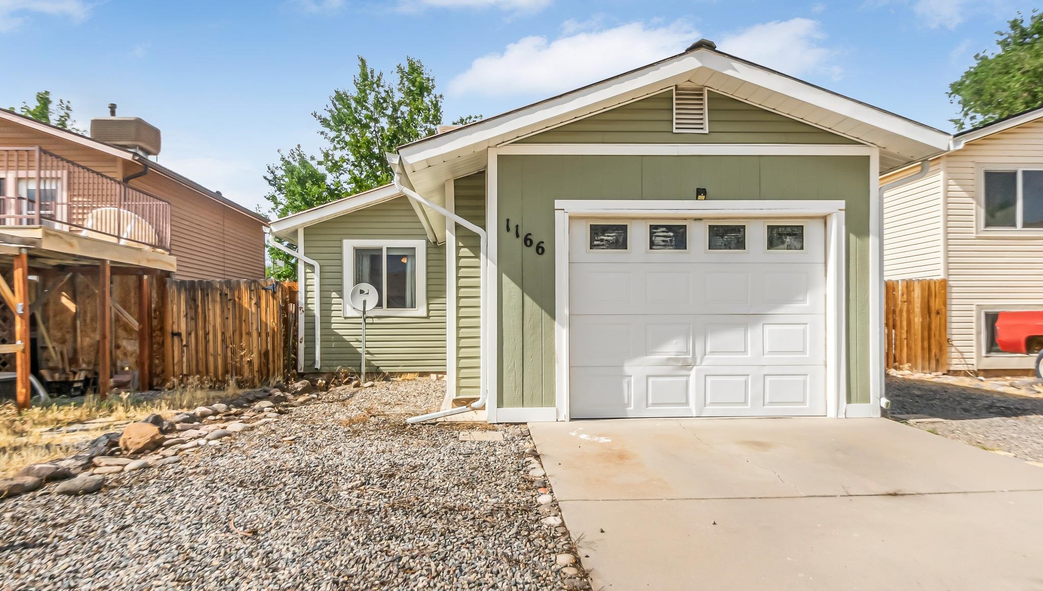 Discover this beautifully maintained 2-bedroom, 1-bathroom ranch-style home in the serene Orchard Mesa neighborhood. Located on a peaceful cul-de-sac, this property offers a one-car garage with RV parking and exudes pride of ownership throughout.  Step inside to find luxurious LVT flooring, an updated kitchen featuring granite countertops, and sleek stainless steel appliances. The bathroom boasts a stunning floor that must be seen to be appreciated! Over the years, this home has been thoughtfully updated with vinyl siding, a durable metal roof, seamless gutters, and a spacious patio perfect for outdoor living.  The fully fenced yard provides privacy and leads to a large common area accessible through a gated entry, offering additional outdoor space to enjoy. The garage is equipped with two generous storage closets, and the custom-built front gate adds a unique and welcoming touch. The yard has access to irrigation and is ready for your landscaping ideas to take shape.