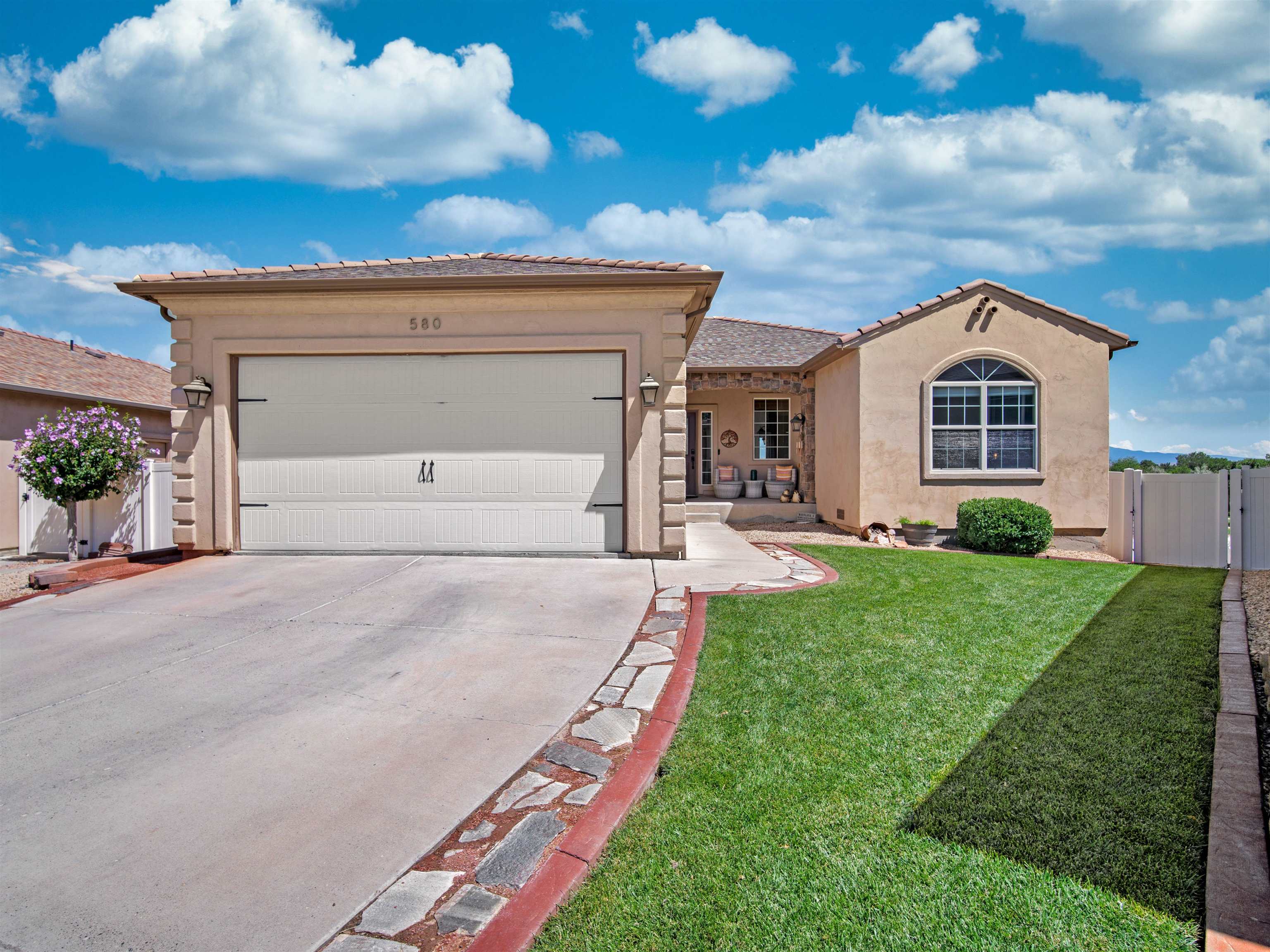 Are you searching for an amazing home with breathtaking views? This stunning ranch-style home in the Legends subdivision offers 2,735 square feet of living space, including 4 spacious bedrooms, 3 baths, a versatile bonus/flex room, and an office space. The luxurious main suite is a true retreat, featuring a jetted tub, shower, dual sinks, and a spacious walk-in closet, with direct access to an upper deck where you can enjoy your morning coffee while taking in stunning views of Mt. Garfield, Grand Mesa. The kitchen and bathrooms showcase Hanstone quartz countertops, providing both elegance and easy maintenance. The home has seen numerous upgrades, including a new HVAC system, Roof Max roofing spray, updated toilets and faucets, a newer irrigation riser, a new sump pump with an alarm, and some mini-split systems. The backyard is designed for fun and relaxation, complete with fresh sod, an in-ground trampoline, a swing set, and a sandbox, making it an ideal play space. Schedule an appointment today or take a look at the 3D Tour!