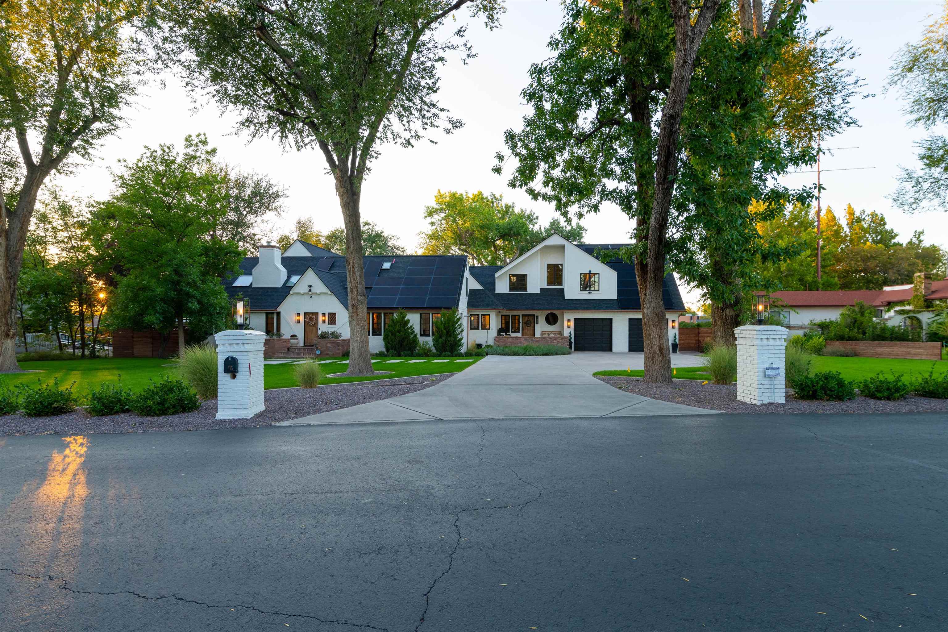 Welcome to this stunning and iconic Country Tudor home in the heart of the Grand Valley with almost 6,000sf of living space. This spacious property features multiple living and dining areas, including a large primary suite upstairs and a junior primary suite on the main level. With a total of 5 bedrooms and 6 bathrooms, there is plenty of room for everyone. Entertain guests in the theater and game room or relax in the office and reading area with floor to ceiling bookshelves. Stay active in the workout room or take a dip in the in-ground pool . The property sits on .72 acre with a fully landscaped, large, fenced yard, front and back patios and mature trees for added privacy.  The open concept kitchen boasts upgraded appliances, a gorgeous wood top island, coffee and wet bar, all perfect for hosting gatherings. Don't miss out on the opportunity to own this luxurious home!