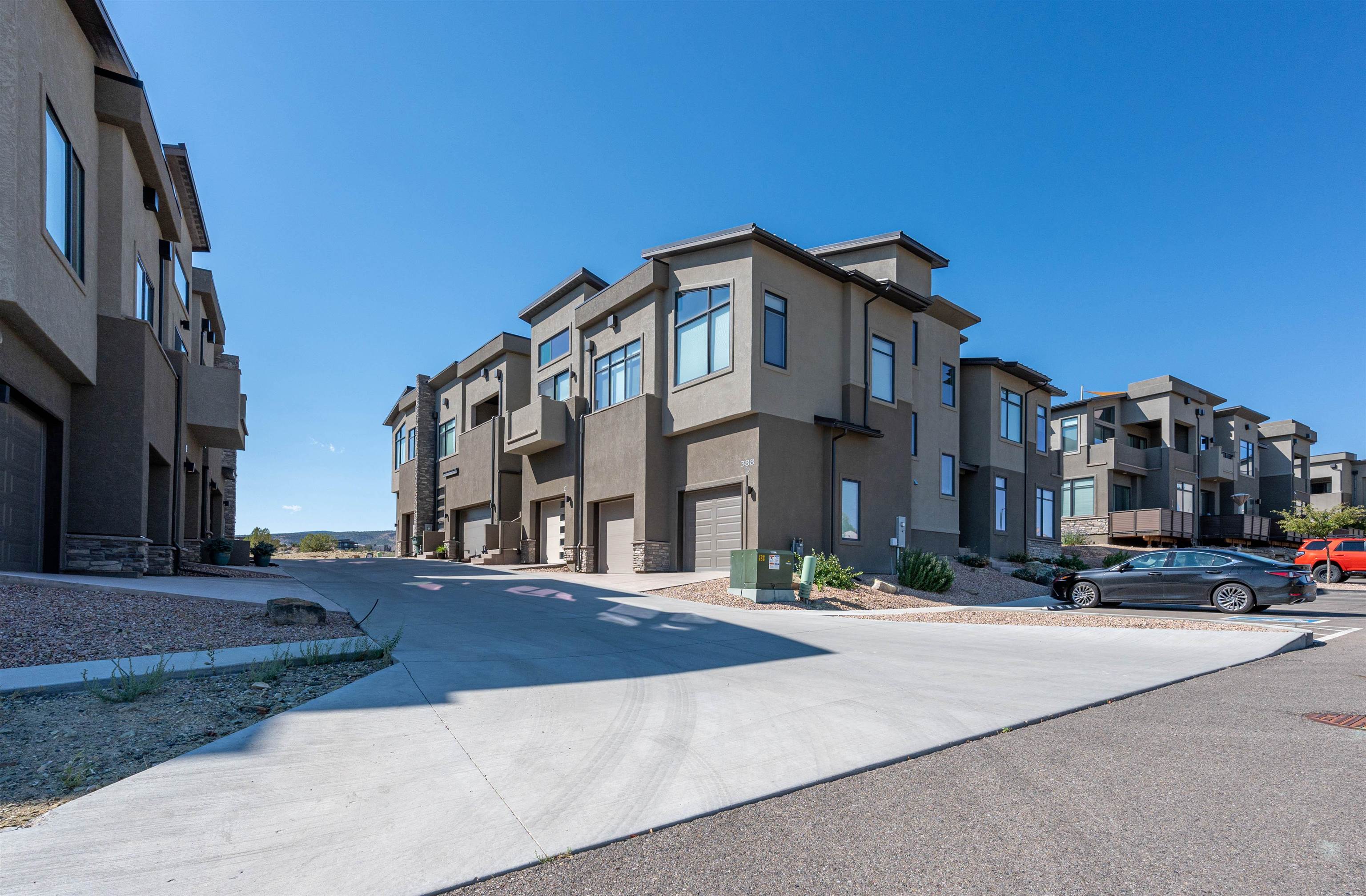 Discover this nearly-new Redlands Mesa Townhome! This residence boasts 2 master suites plus an office that can serve as a versatile, non-conforming 3rd bedroom. Perfect for summer evenings, you can entertain on the rooftop with golf course & Colorado National Monument views; while taking in the benefits of the Redlands Mesa community. The home is well-maintained and move-in ready.