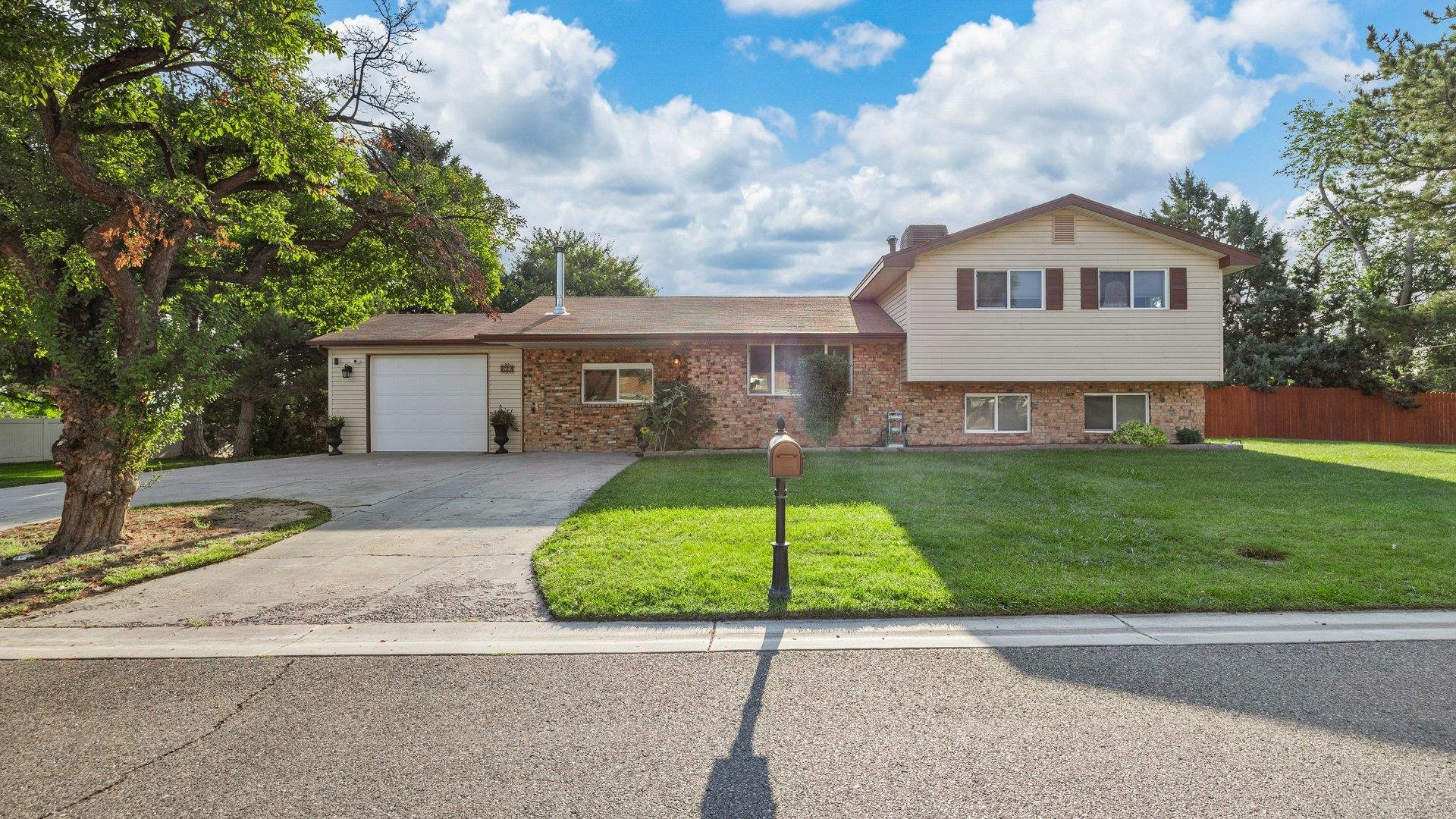 Looking for the perfect four-bedroom retreat in the Redlands with almost an acre to call your own? Look no further! Imagine starting each day with a fresh cup of coffee on your patio, soaking in breathtaking views of the Bookcliffs and the Mesa. Evenings can be your time to unwind and recharge in your private hot tub. This home offers not just one but *two* garages—an attached and a detached—for all your storage and workshop needs, plus the bonus of owned solar panels to keep energy costs down. Set in the scenic Panorama neighborhood, you'll enjoy stunning views of the Colorado National Monument and the welcoming community of established neighbors. Let’s turn this dream into your new home today!