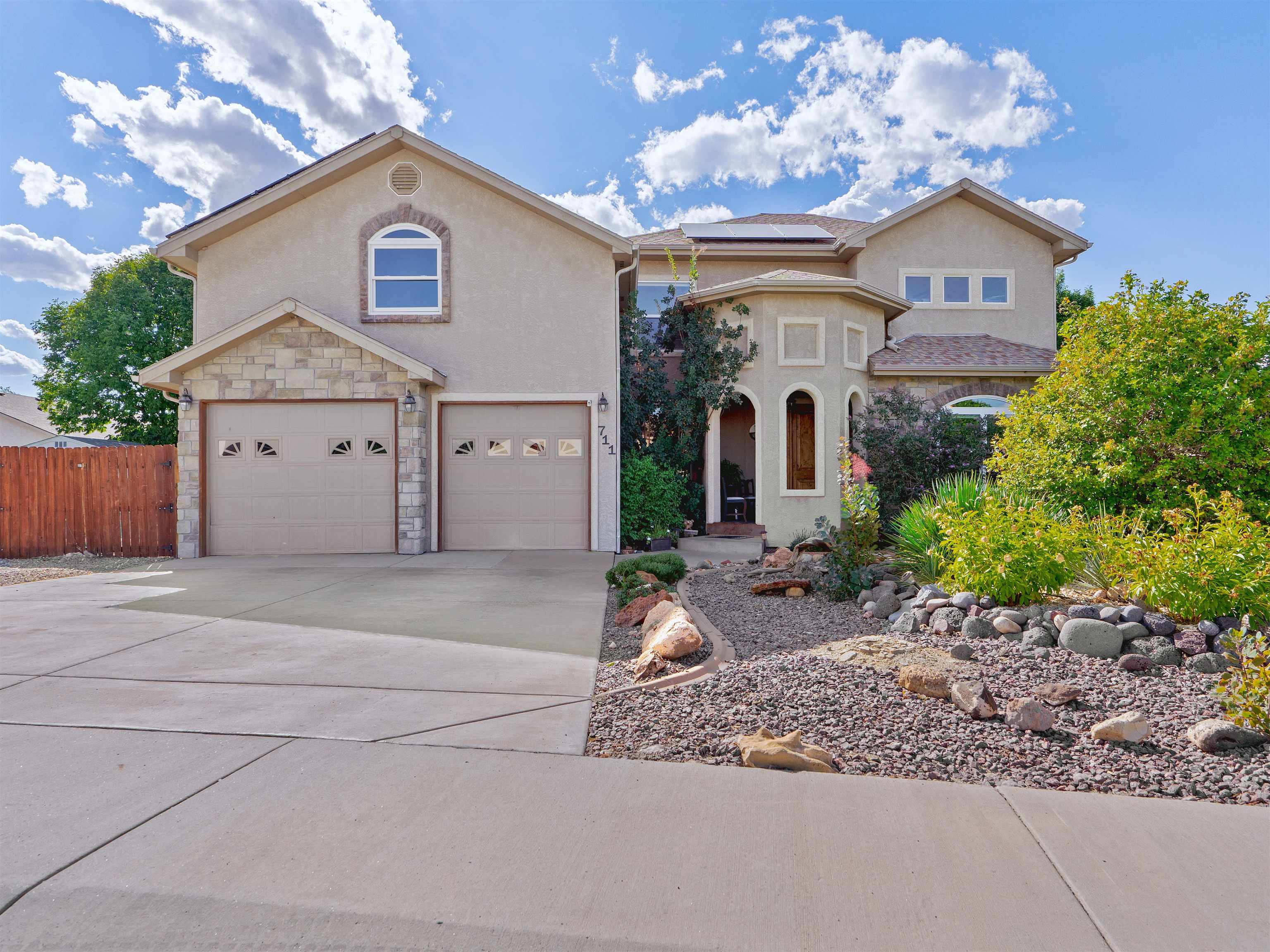 Stunning Fruita home in desired Vintners Farm subdivision! Gourmet kitchen with stainless-steel appliances, including 2 pantries, breakfast nook, and breakfast bar. The main level has formal dining, hardwood floors, vaulted ceilings, stone corner fireplace, and sitting room/office. Spacious master suite has 'his and her' walk-in closets and 5-piece master bath with access to the back porch. Up the stairway are 3 bedrooms, 2 full baths, and a bonus room, all connected by an open balcony overlooking the living room. Extra storage in the lighted and clean crawlspace. New upstairs window, new carpet in 2020, SAMSUNG smart fridge, convection oven, soft close drawers are just some of the many upgrades. Newly added and OWNED solar system valued at $50,000 makes your monthly utility bills as little as $11/month.  Beautifully landscaped low maintenance yard with sprinkler and drip system. Backyard has covered patio, pergola, and fruit trees, along with open access to common areas. Pond (w/fishing), sand volleyball, gazebo, playground all included. Enjoy your views of the ducks on the pond, as this property backs up to the park and walking paths. This property has it all! Schedule your showing today!