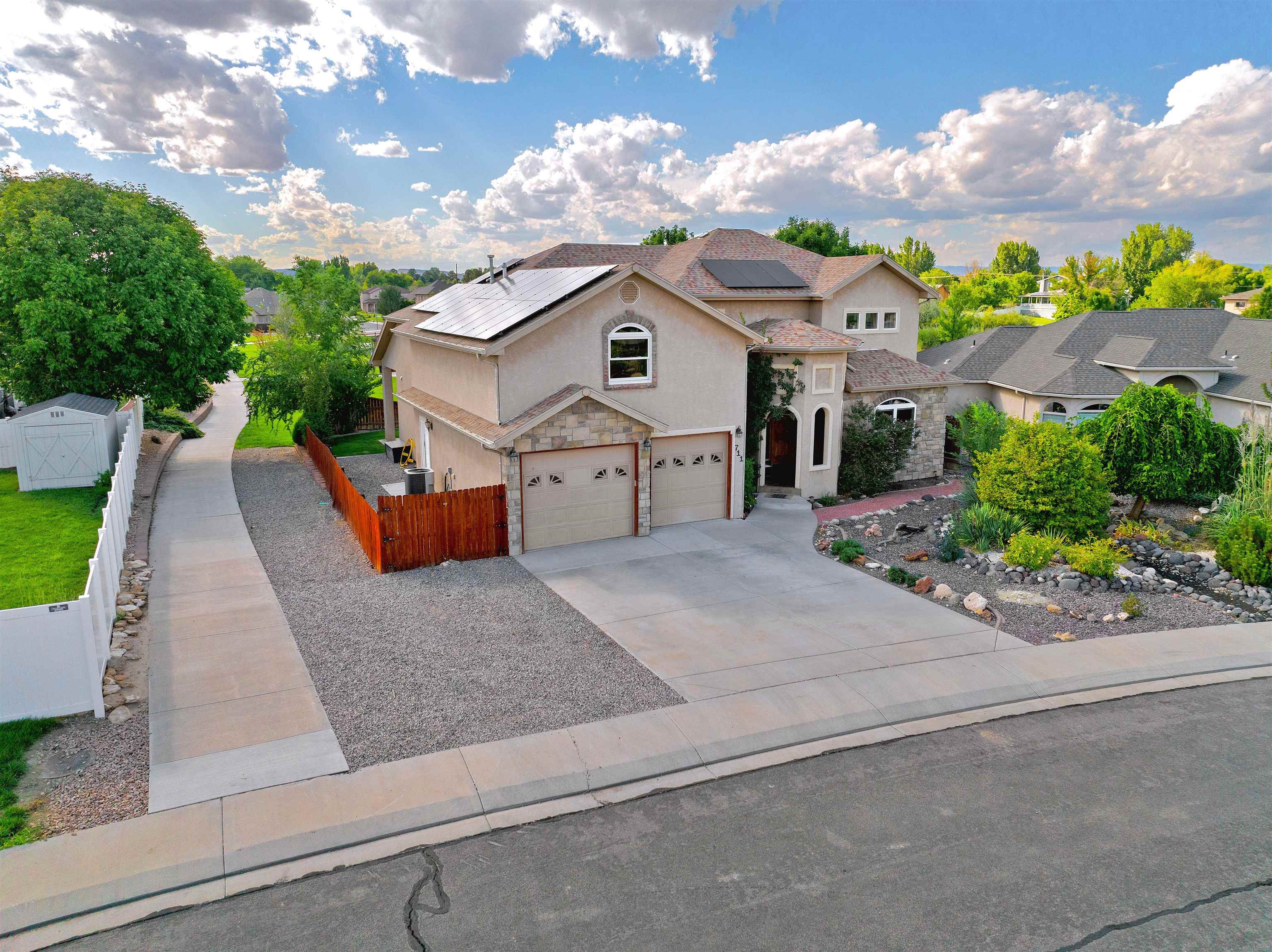 STUNNING Fruita home in desired Vintners Farm subdivision!! Gourmet kitchen with stainless-steel appliances, including 2 pantries, breakfast nook, and breakfast bar. The main level has formal dining, hardwood floors, vaulted ceilings, stone corner fireplace, and sitting room/office. Spacious master suite has 'his and her' walk-in closets and 5-piece master bath with access to the back porch. Up the stairway are 3 bedrooms, 2 full baths, and a bonus room, all connected by an open balcony overlooking the living room. Extra storage in the lighted and clean crawlspace. New upstairs window, new carpet in 2020, SAMSUNG smart fridge, convection oven, soft close drawers are just some of the many upgrades. Beautifully landscaped low maintenance yard with sprinkler and drip system. Backyard has covered patio, pergola, and fruit trees, along with open access to common areas. Pond (w/fishing), sand volleyball, gazebo, playground all included. Enjoy your views of the ducks on the pond, as this property backs up to the park and walking paths. This property has it all! MAKE US AN OFFER!!