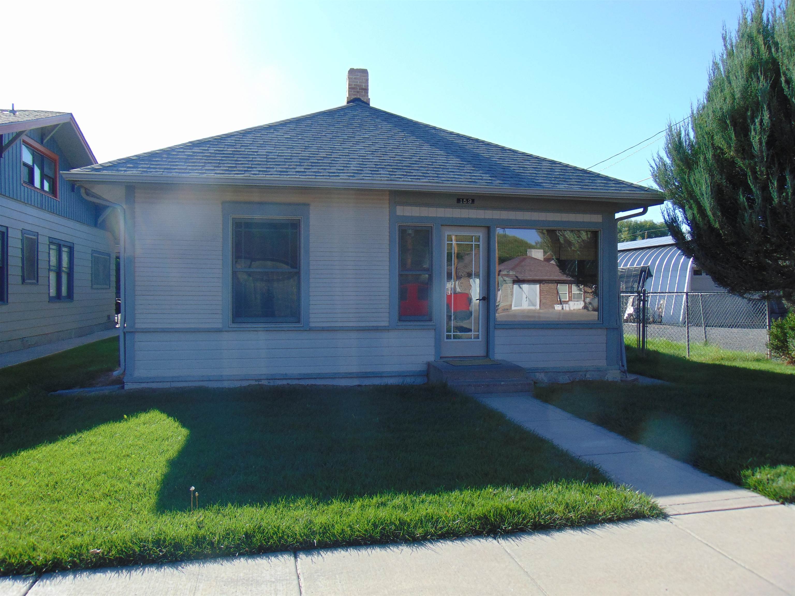 Downtown Fruita Charmer. Built in 1912 has all the character and charm + funky Fruita Vibe you are looking for. Updated windows, roof is 6 years old, 3 solar tubes, concrete countertop, hammered metal kitchen sink, wide wood trim.  Living and dining area are adjacent and will accommodate your friends and family. Enclosed front porch is great for place for morning coffee and covered back porch for afternoon beverages! Detached 2 car garage + carport, alley access and a fully fenced back yard. Timed sprinkler system for front and back yards, mature plants and room for garden area.