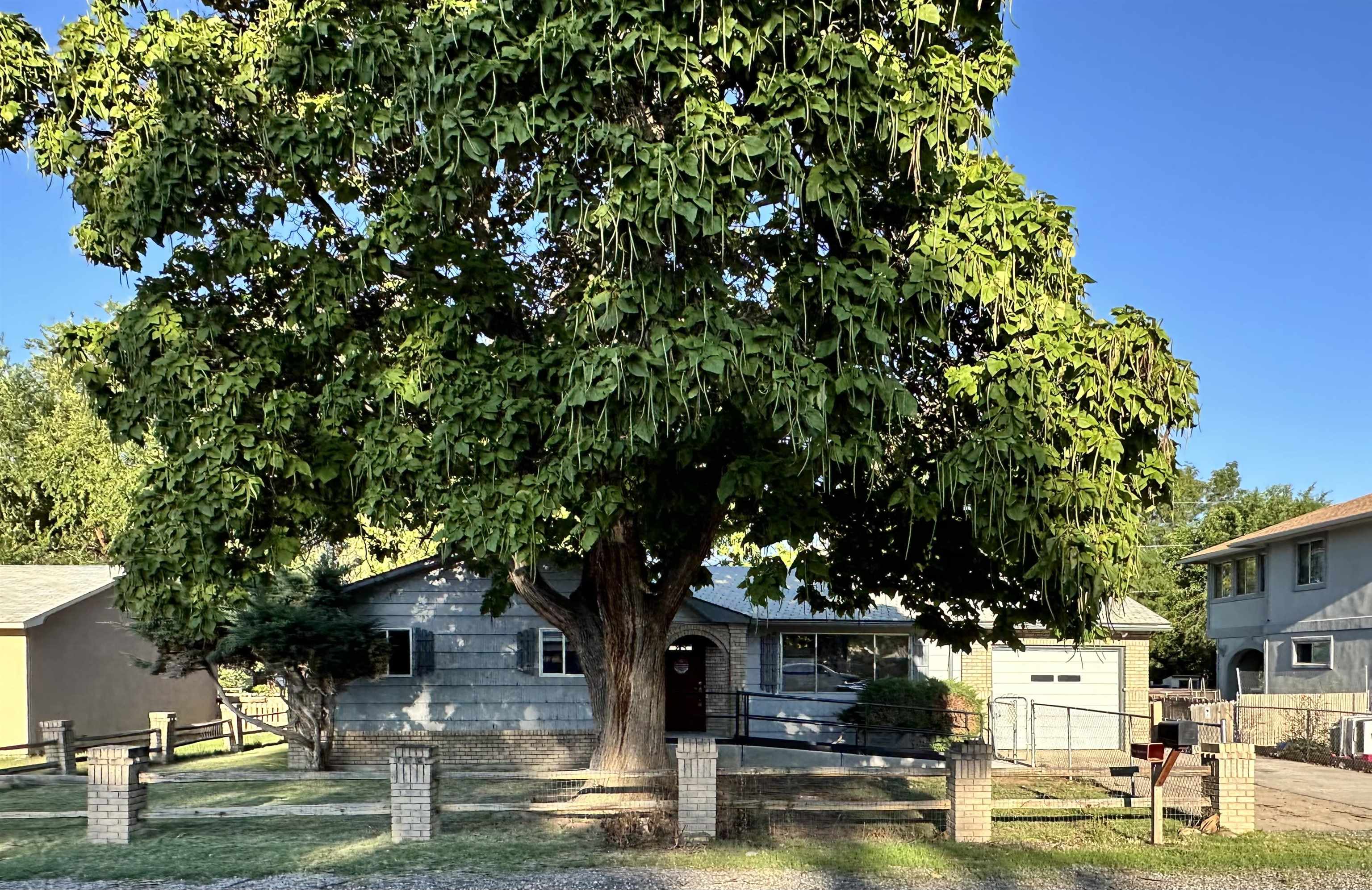 Welcome to this mid century home nestled in the heart of Orchard Mesa. It offers a great opportunity to put some sweat into building equity while making the home yours. It features an open living and dining area with an ample kitchen perfect for the cook at heart. Most of the home has had some updates but there is still plenty of ways to add your personal touch. There is plenty of room for storage with the 2 outbuildings: Carport is 20‘ x 11‘ & Storage Shed is 14' x 8' with room also in the Garage. In the back if the home find a large covered patio is 13' x 20'.  Great opportunity for the owner occupant, financing incentives may be available. Contact us for a private showing and for more information about HUD properties.