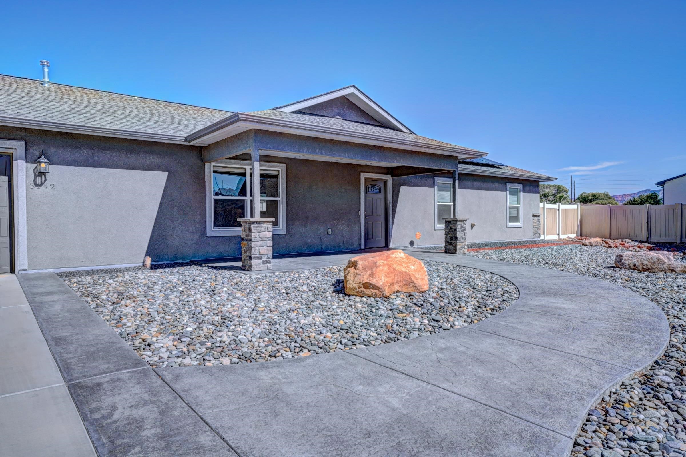 This single owner, 3 bedroom 2 bathroom ranch with no steps, screams Pride of Ownership! Notice the stamped concrete details as you walk up to this bright open concept home with vaulted ceilings. The kitchen showcases soft close cabinets with quartz counters, built in trash cans, pantry with pull out shelves and stainless steel appliances. Top down-bottom up custom blinds throughout. Stucco and stone exterior with a large side yard. Owned solar keeps your utility costs at a minimum. Schedule your private tour NOW before this one is gone!