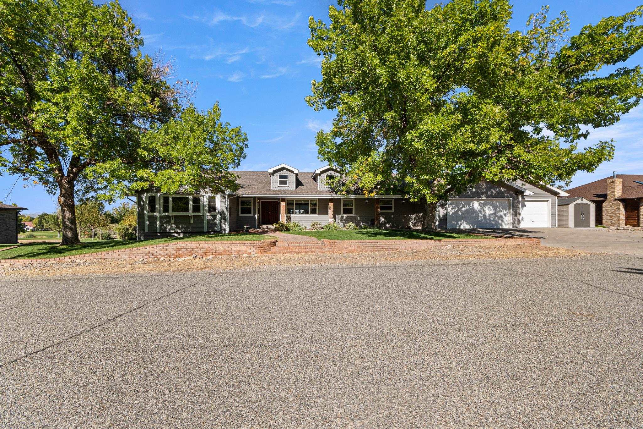 Imagine waking up to breathtaking views of rolling greens and perfectly manicured fairways. This spacious 4 bedroom Ranch home, with a 700 sqft finished basement, is nestled on the Tiara Rado Golf Course with stunning views surrounding the house. Experience tranquility from both the living room or family room while relaxing and looking out the large windows, showcasing the golf course. Enjoy outdoor living on the expansive deck that offers panoramic views of the Colorado National Monument, the Bookcliffs and the Mesa. Many important upgrades have been made to the residence. whether you are a golfer or someone who enjoys serene, picturesque living, this home is one you don't want to miss.