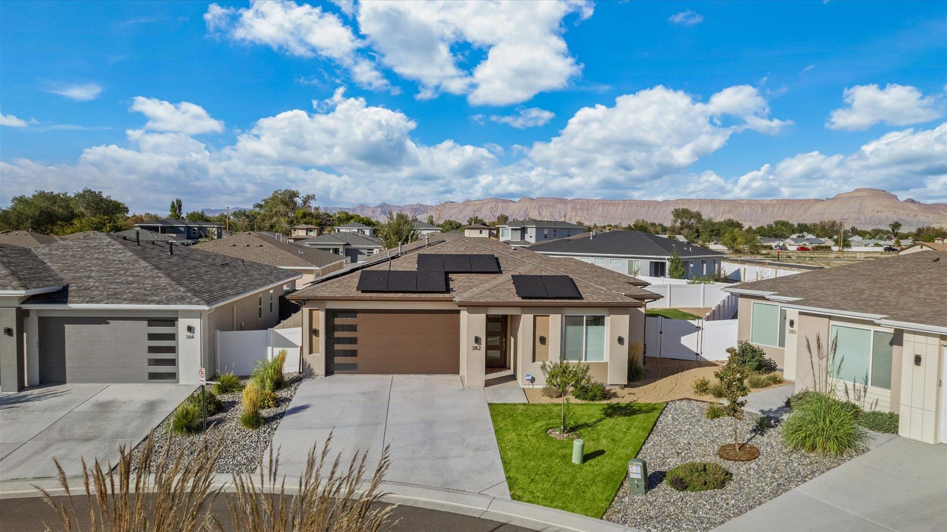 Step into this recently built (2021), beautifully designed home in the new River Walk Subdivision.  This 1,588 square foot, 3 bed / 2 bath home is stunning! First, before you go inside, enjoy the beautiful weather the Western Slope has to offer by taking a leisurely walk or bike ride with direct access to the River Front Trail System less than a block away.  Finish up your day watching the sun set in the privacy of your backyard under the covered patio. If the weather is not cooperating, enjoy the spectacular view of the Grand Mesa and Mt. Garfield while relaxing in the living room. Finally, call it a night in the spacious, private and exceptionally designed primary bedroom suite. Check in on the pets when you aren’t home with the 5 camera Ring security system that stays with the property.  There is so much to love about this home! Let’s find a way to make it yours in time for the holidays.