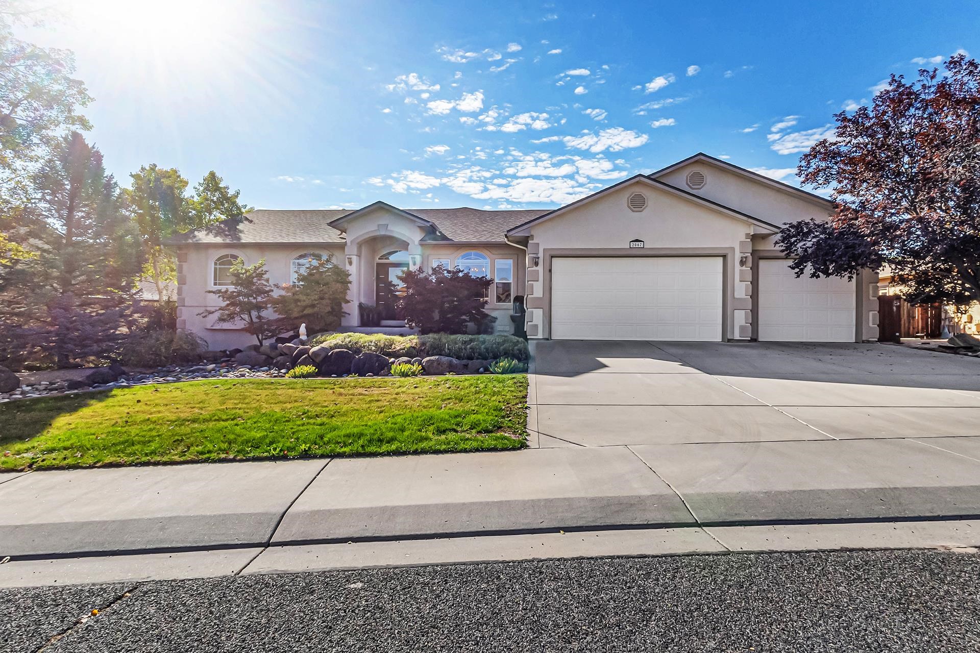 This is a must see very well-maintained rancher tastefully designed, located on        cul-de-sac, three car garage, 2978 square feet finished with basement partially       finished & 1,042 sq. ft. unfinished storage area.  Main level has tile floor with design flowing to second dining room, living room, kitchen and hall area.  Living room & nook/dining located on south side of home with vaulted ceilings, large windows to bring in natural light, viewing back yard and accesses covered deck off nook area.   Designated office off entry could be another bedroom.  Cherry cabinets with granite countertops, gas cook top, refrigerator, stainless steel sink & elevated bar area, built in microwave and oven, and large separate pantry.  Master bedroom on east side of home is carpeted has windows overlooking back yard & windows on east wall for natural light.  Master bath with walk-in closet, walk-in shower, double vanities and jacuzzi tub with frosted window above.  There is another guest suite with bath on west side of main level with access to back covered deck, which could be mother-in-law setup.  Laundry room between kitchen & guest suite, cabinet with drop-in laundry sink, washer, dryer, upper cabinets, closet and window for more light. Carpeted stairs to basement area opens up to designated library area with    book shelves, and access to outdoor patio in back yard.  This room also accesses unfinished portion of the basement with awesome amount of room for storage, work bench, and shelving.   The remainder of the finished basement has two bedrooms with Jack-n-Jill set up.  Three car garage with built-in cabinets, work bench and door to back yard.  Yard has mature landscaping with pressurized irrigation system.  All information is subject to error/change and should be verified by buyer.