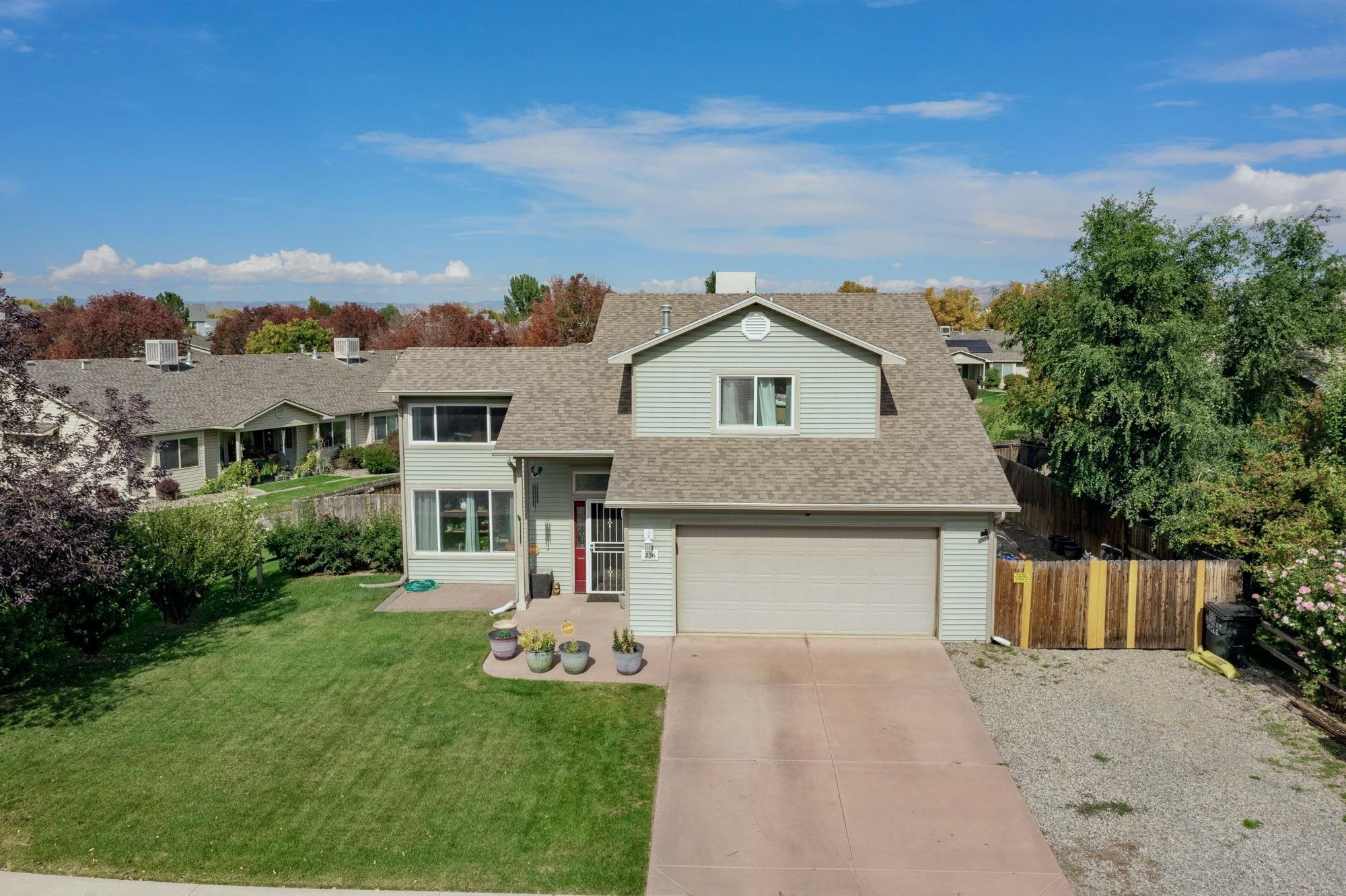 $10,000 SELLER CREDIT TOWARDS CLOSING COSTS! - Pet lovers dream! Welcome to 256 Sargent Circle, a fantastic 4-bedroom, 2-bathroom family home located in the heart of Fruita, Colorado. This two-level home offers plenty of space and comfort, featuring a charming living room with a gas stove for cozy winter heating, a street level primary bedroom, a 2-car garage, and excellent RV and boat storage. Enjoy a short walk to downtown Fruita's shops, dining, and festivals, with easy access to the nearby frontage road for a quick and convenient drive to Grand Junction. Across the street, you'll find a park perfect for outdoor fun, while the home's quiet location has no neighbors directly behind, offering added privacy. To the west, expansive open space provides a perfect setting for scenic walks and stunning Colorado sunsets. The backyard is ideal for pet lovers, complete with a dog run and a custom-built cat patio for your furry friends to safely enjoy the outdoors. Don’t miss out on this wonderful opportunity to call Fruita home!